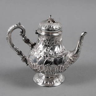 HANAU SILVER COFFEE/HOT WATER POT: Hanau, Germany late 19th century. An attractive 930 silver small coffee or hot water pot with an elaborate repousse design. 5.75" high and 274 grams. The foot is slightly compressed but could easily b