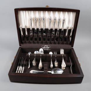 NORTHUMBRIA STERLING FLATWARE SET: Canada, last quarter 20th century. Sterling silver flatware service for 8 in the Normandy Rose pattern. This 61 piece set comprises: 8 dinner forks; 8 dinner knives; 8 butter spreaders/knives; 8 ^dess