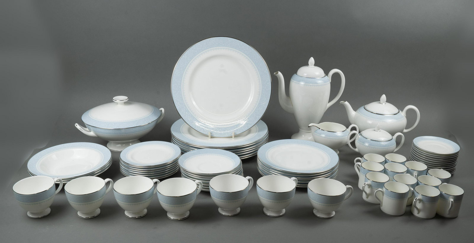WEDGWOOD PART DINNER SERVICE: England, late 20th century An attractive Wedgwood part dinner service in the Mayfair pattern. Comprises: 8 dinner plates, 7 luncheon plates, 8 bread/side plates; 7 teacups and saucers;12 demitasse cup