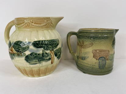 2 Roseville Pottery Pitchers: Bulbous landscape 7 1/8"and landscape with bridge.