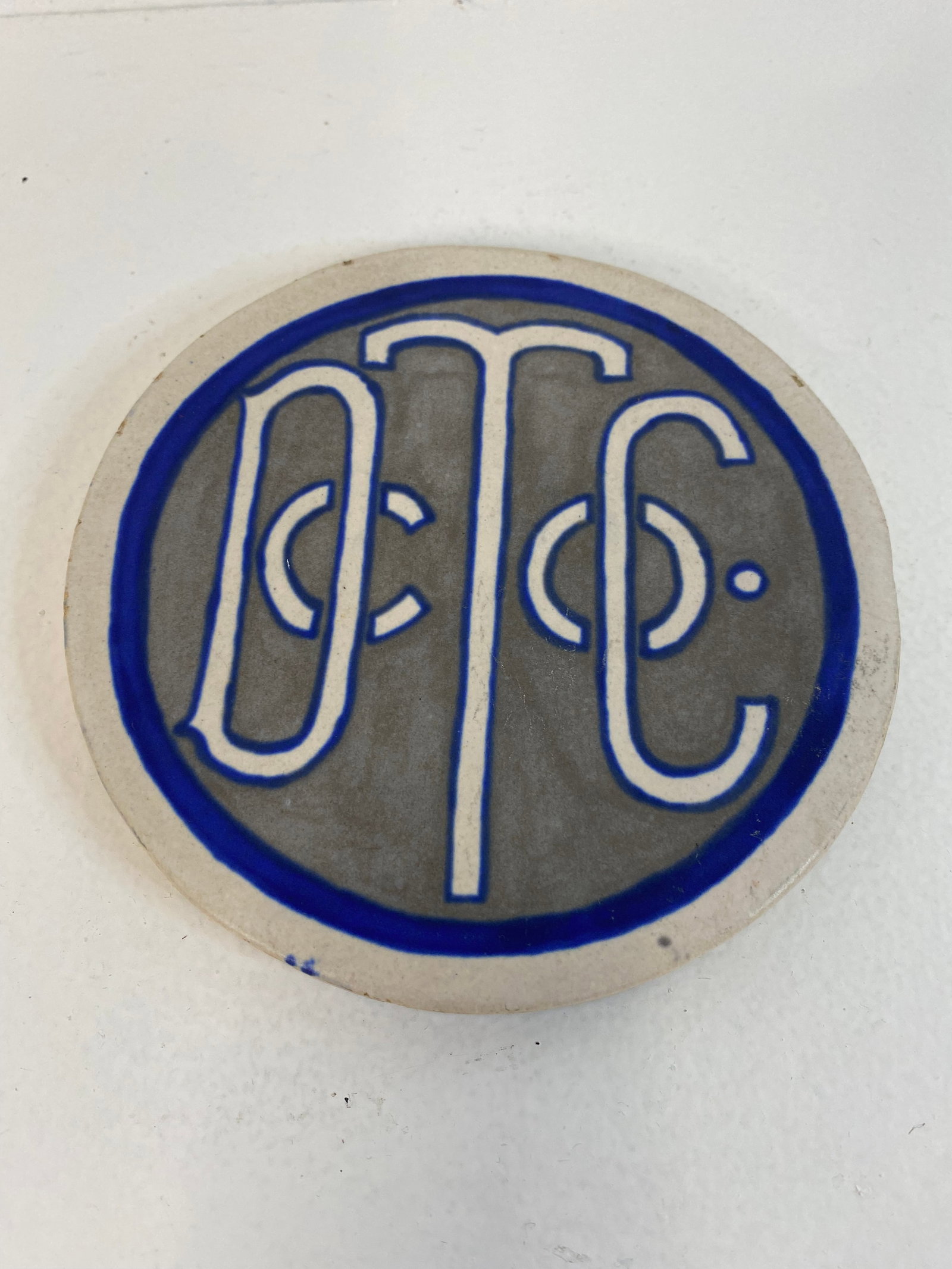 Denver Terracotta Works: Advertising plaque 5 1/2" diameter