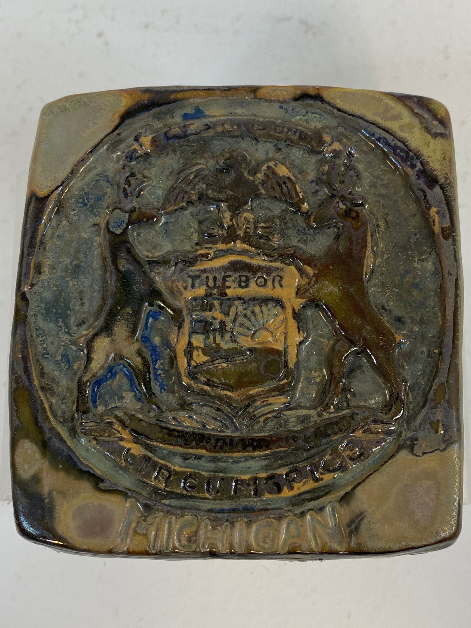 Pewabic Pottery: Cool tile souvenir made for the state of Michigan, The words Tuebor Circumspice are easily read. 3 5/8" square