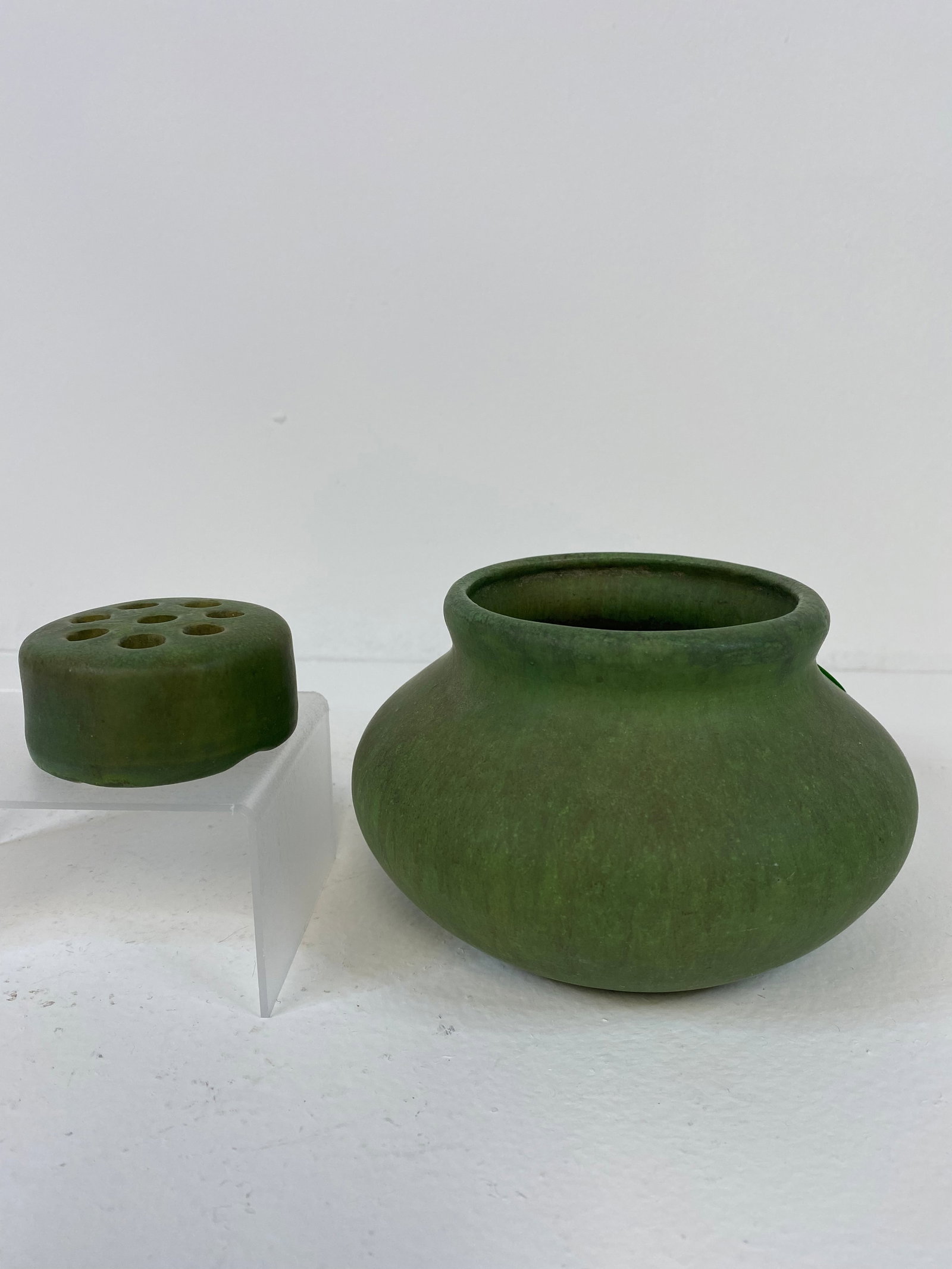 Roseville Pottery Carnelian: Early matt green Carnelian with the red bottom at 3 1/2" x 6" across. Comes with flower frog