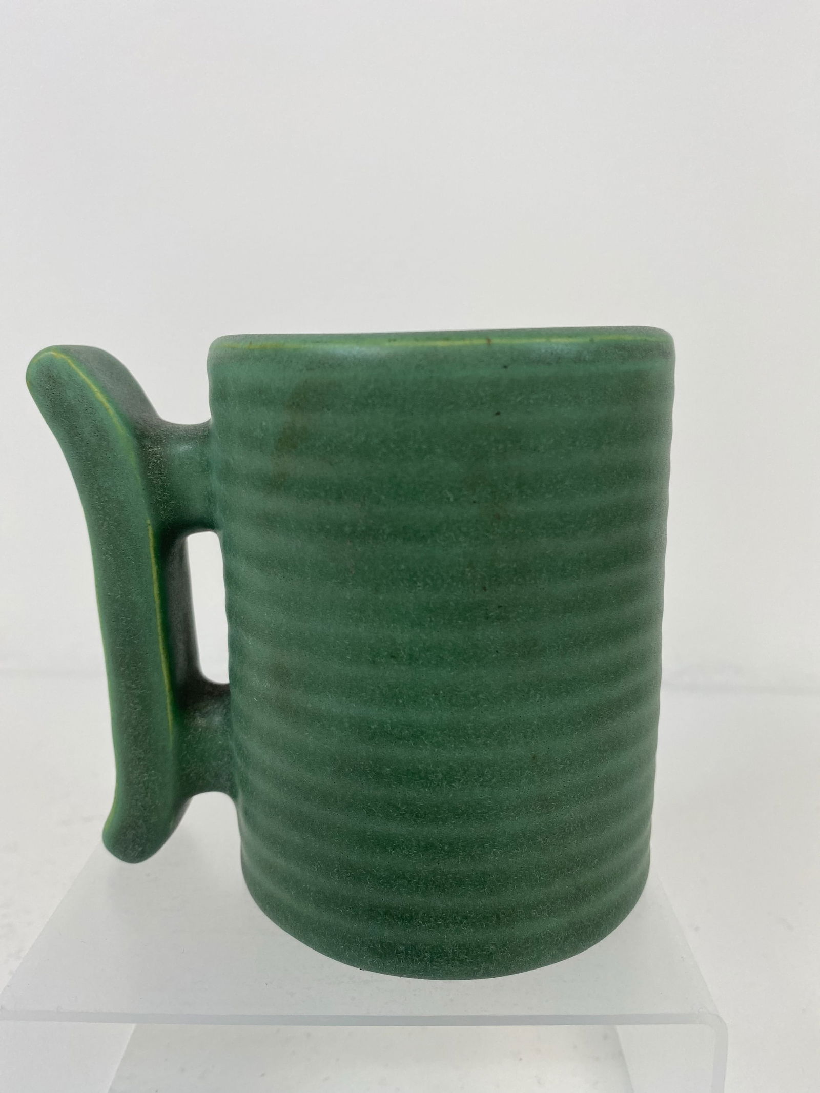 Teco Pottery: Unusual ribbed mug with a cool design on handle. Stamped twice and 3 1/2" tall