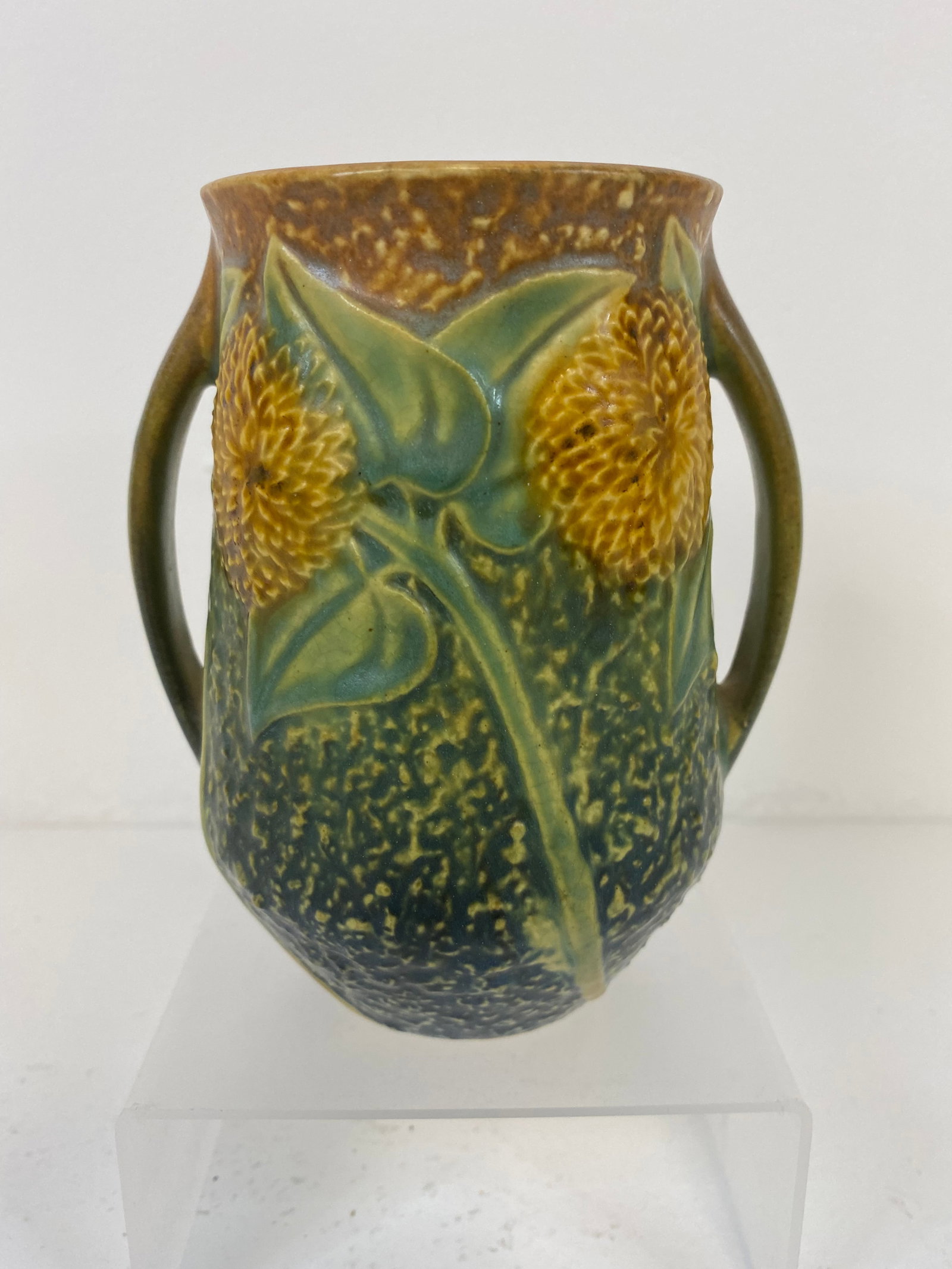 Roseville Pottery Sunflower: Nice sunflower vase with a crisp mold and original foil sticker on bottom. 5 1/8" tall