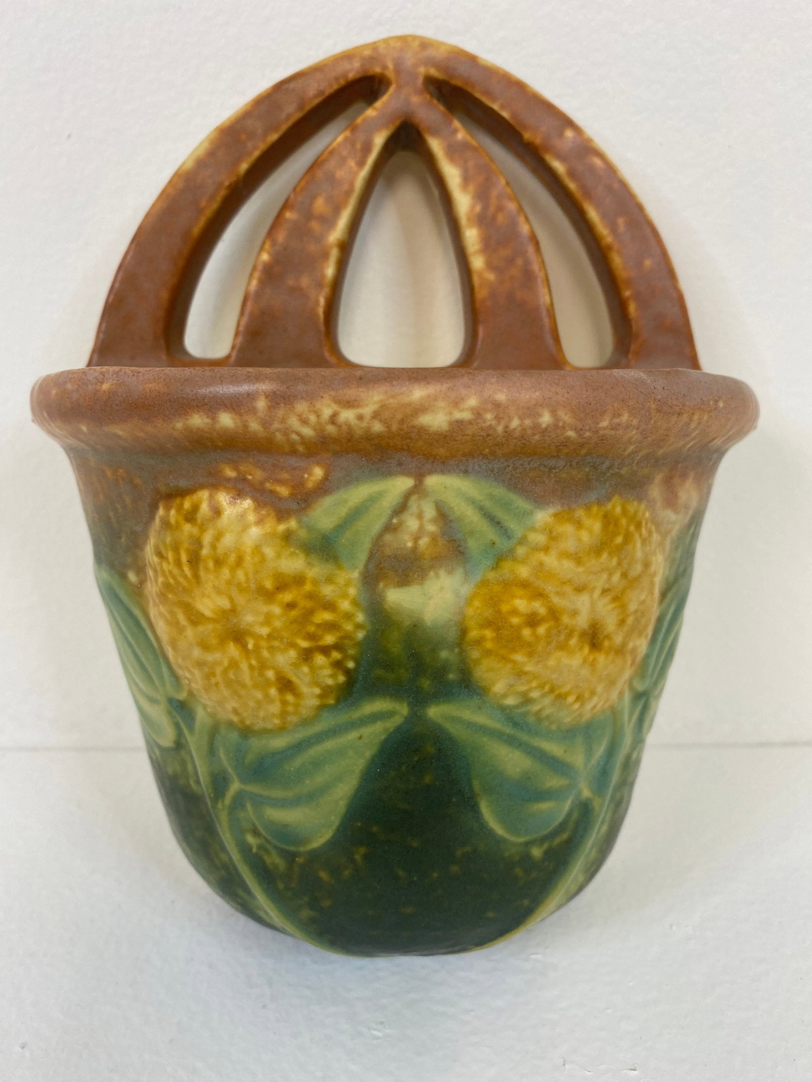 Roseville Pottery Sunflower: Sunflower wall Pocket standing 7 1/2" tall. Becoming harder to find