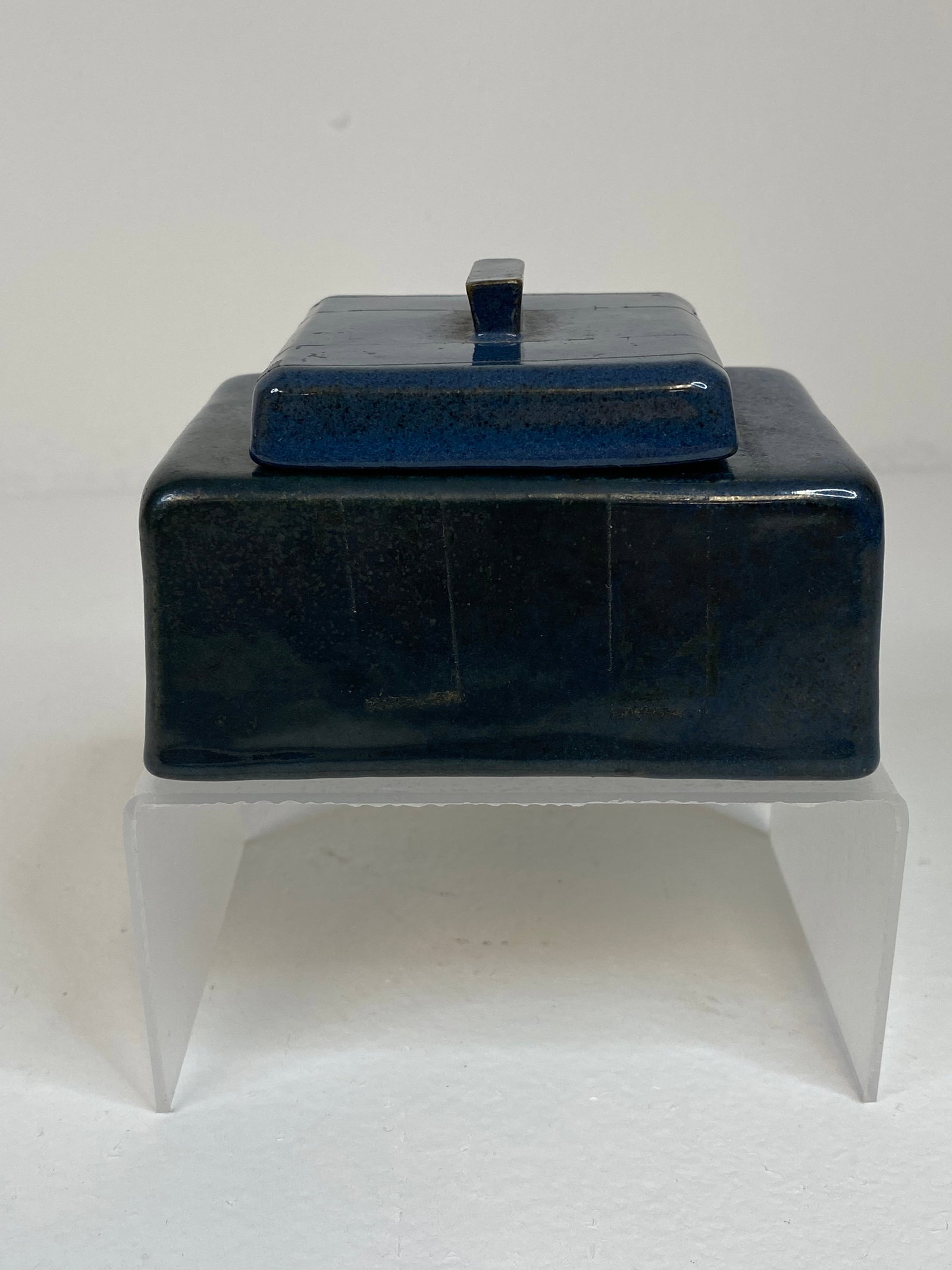 Paul Revere Pottery: This inkwell has a nice blue-mottled glaze with the original paper label, measuring 3 3/4" wide