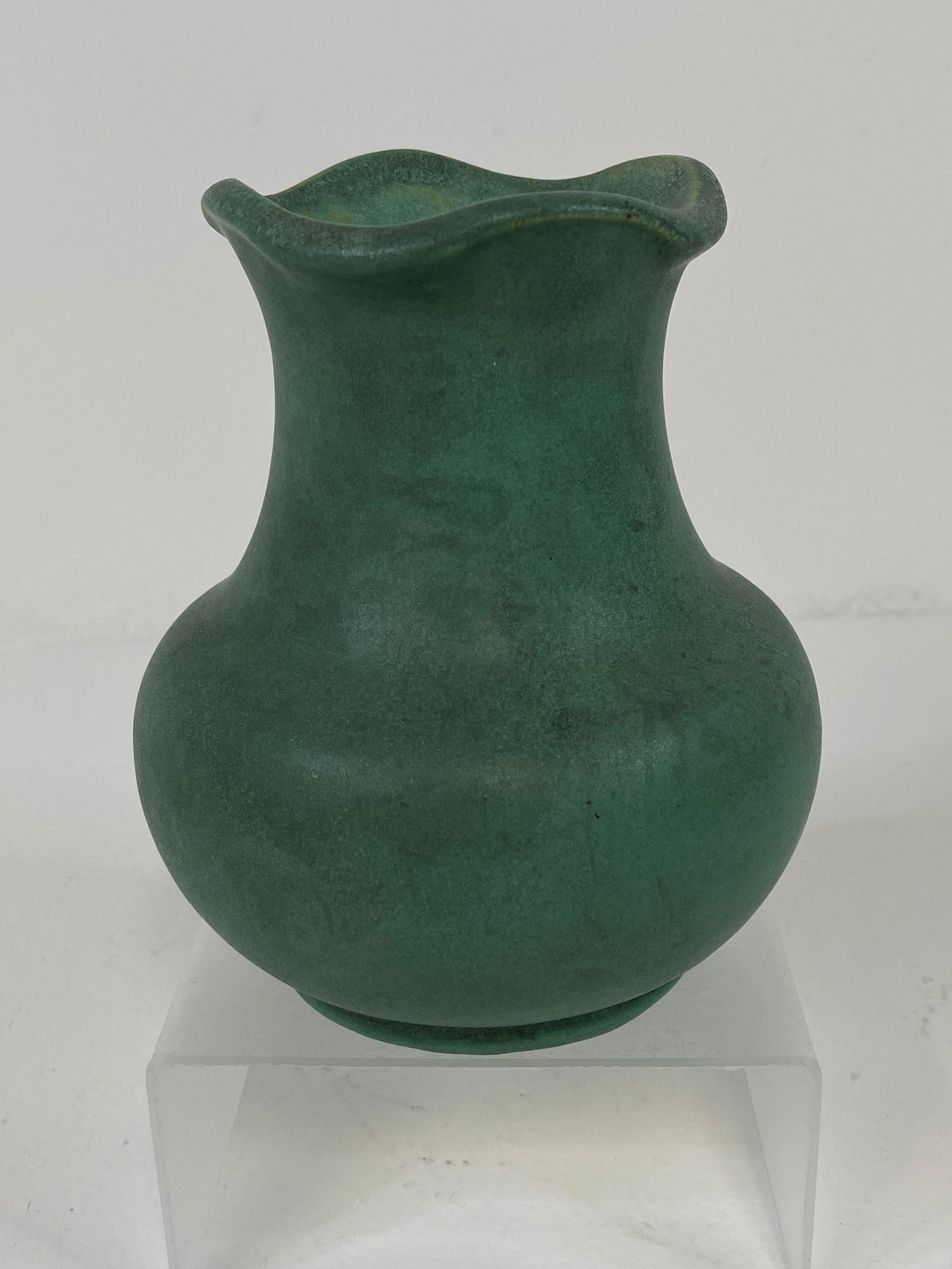 Teco Pottery: Shape number 233, stamped twice, this ruffled rim vase stands 5 1/8" tall with lots of charcoaling