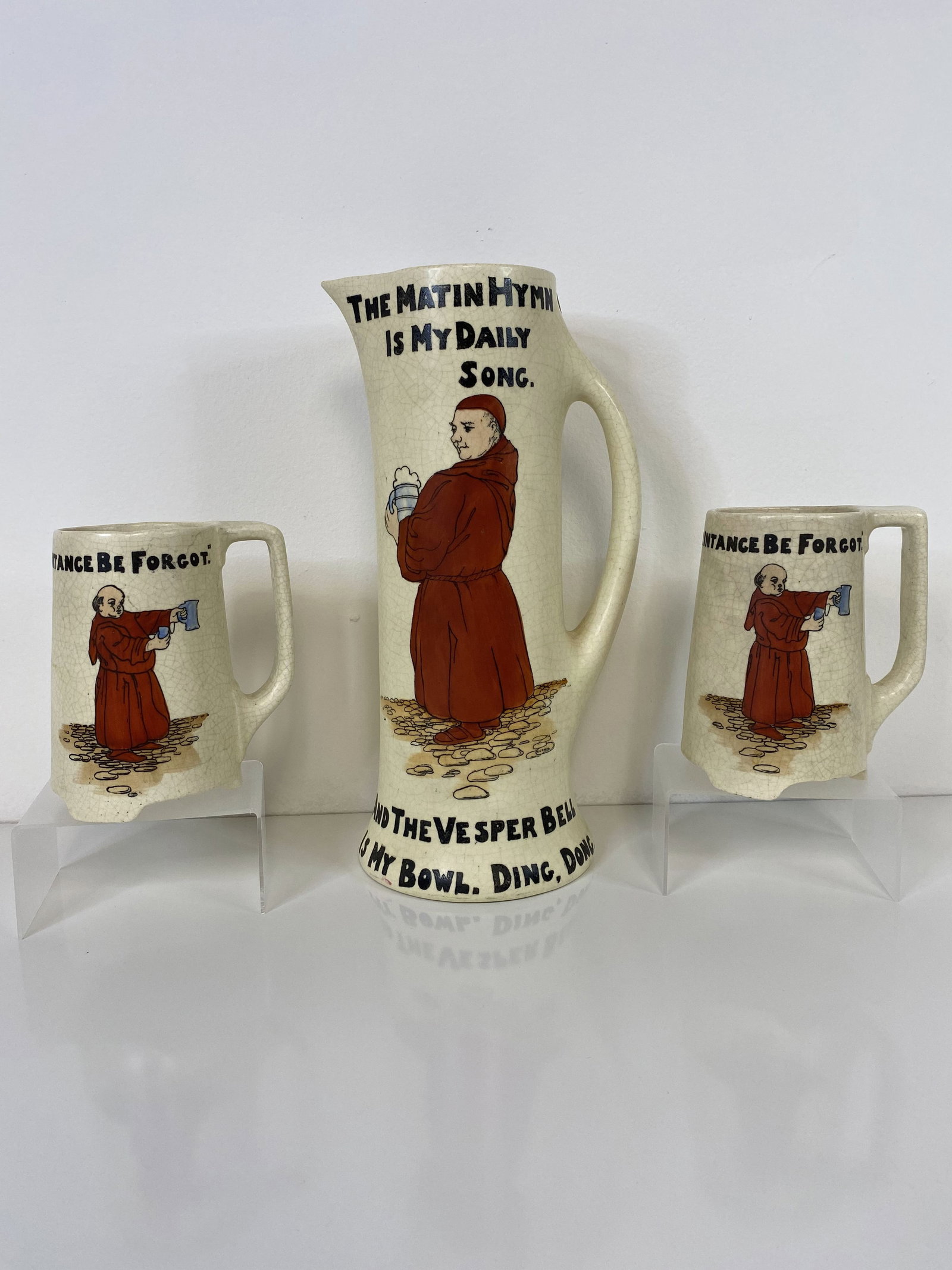 Roseville Pottery Creamware: Very hard to find pitcher of the Matin Hymn and Vesper bells adorn this Tall Pitcher and comes with 2 mugs. Pitcher is 11 3/8" tall