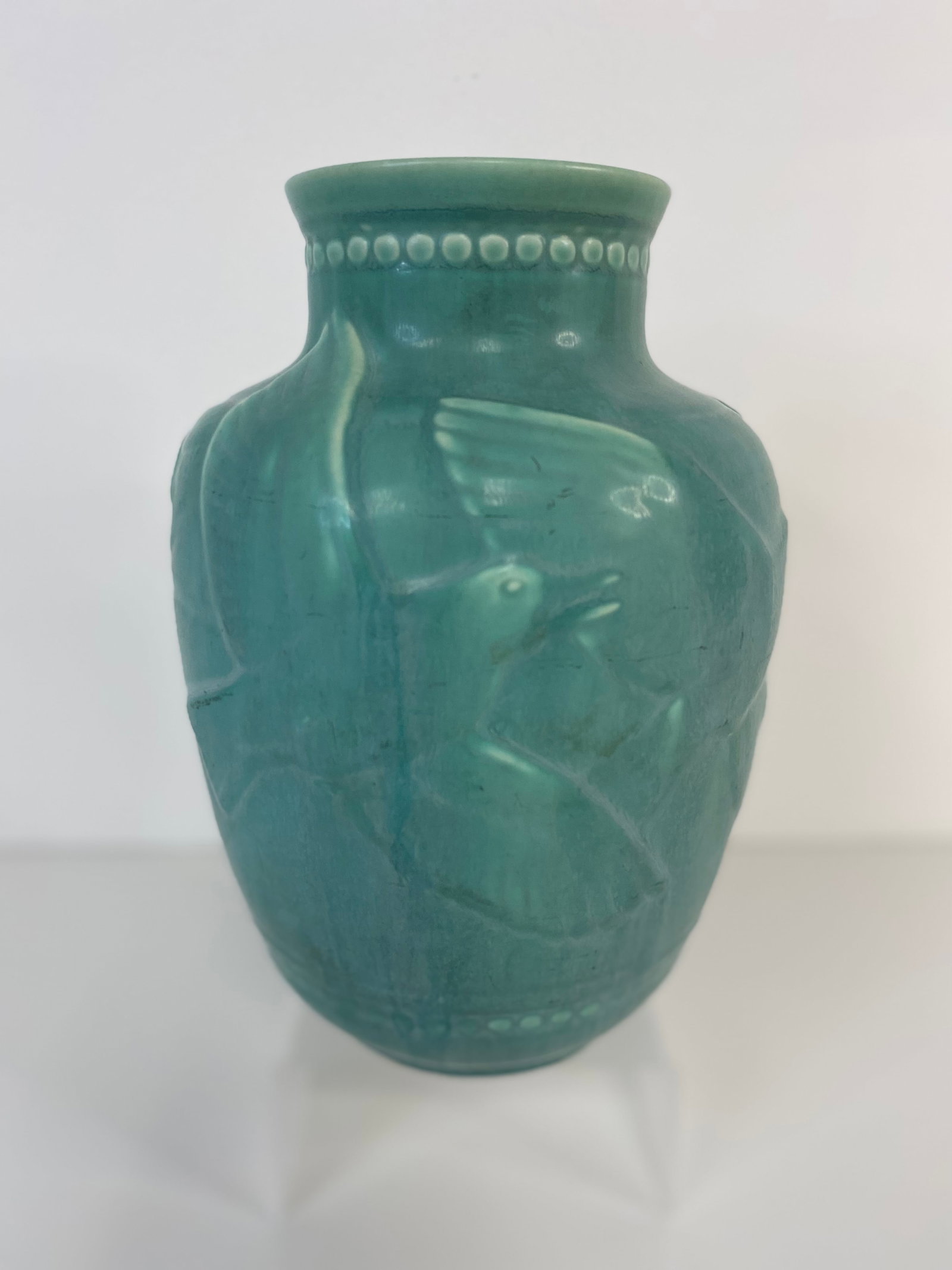 Rookwood Pottery Vase: This Rookwood vase features birds in flight and was made in 1938 mold #6486 and stands 8 1/4" tall