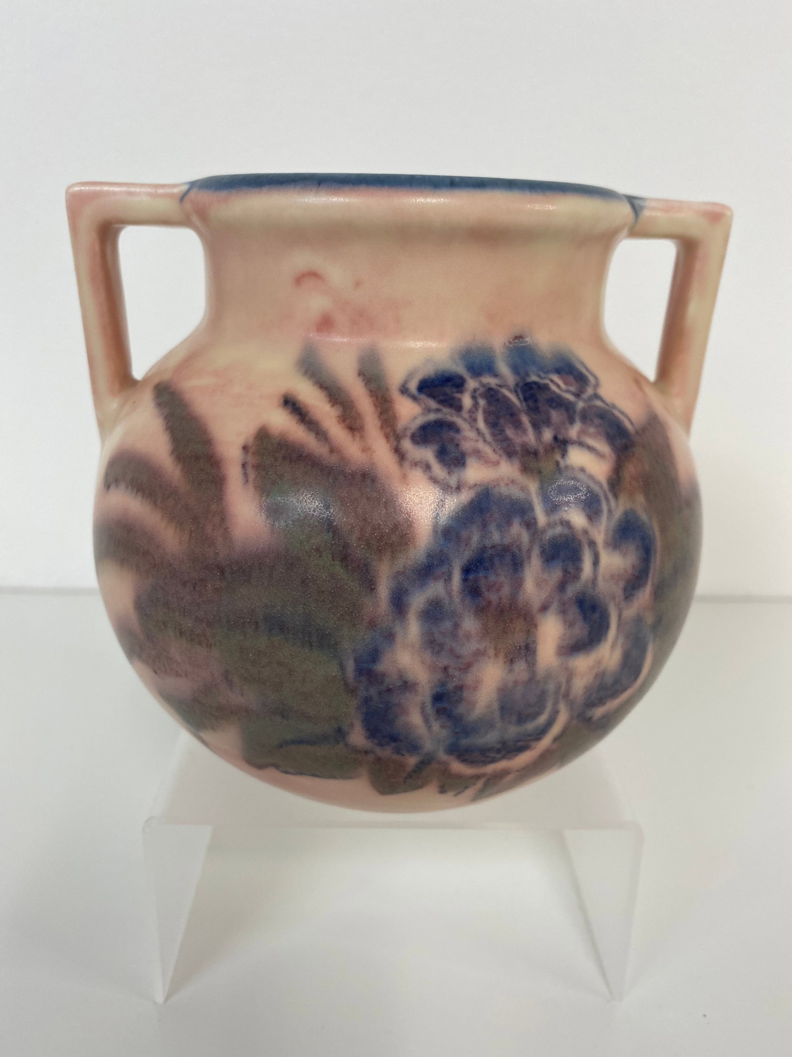 Rookwood Pottery Vase: Made in 1931 by Wilhelmine Rehm. Softer colors on this cool vase decorated on both sides. Measures nearly 5" tall and 5 1/4" wide. Uncrazed