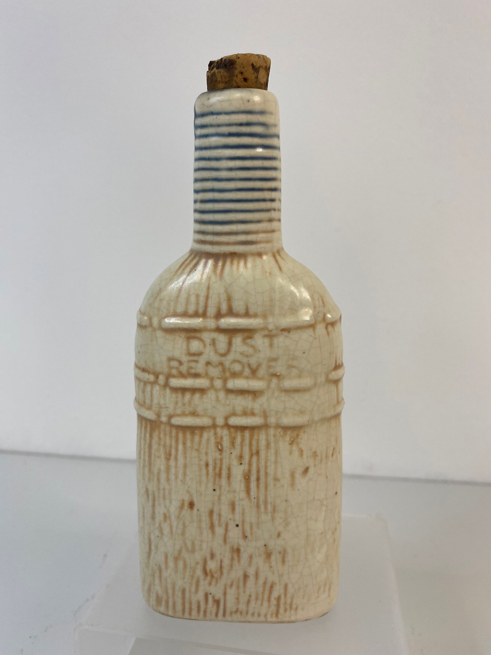 Weller Pottery Flask: Dust Remover is embossed in this cute Flask by Weller Pottery.6 1/8" long