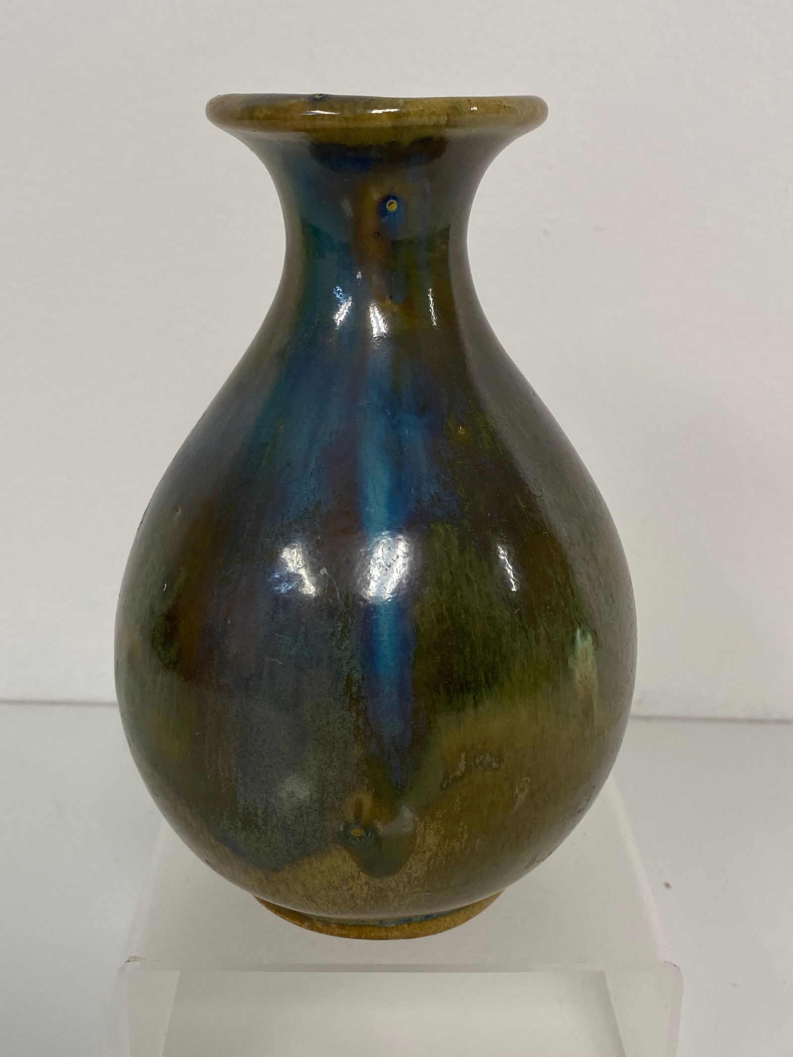 Shearwater Pottery multi colored vase: Blues, greens and browns make up the glaze of this 6" vase