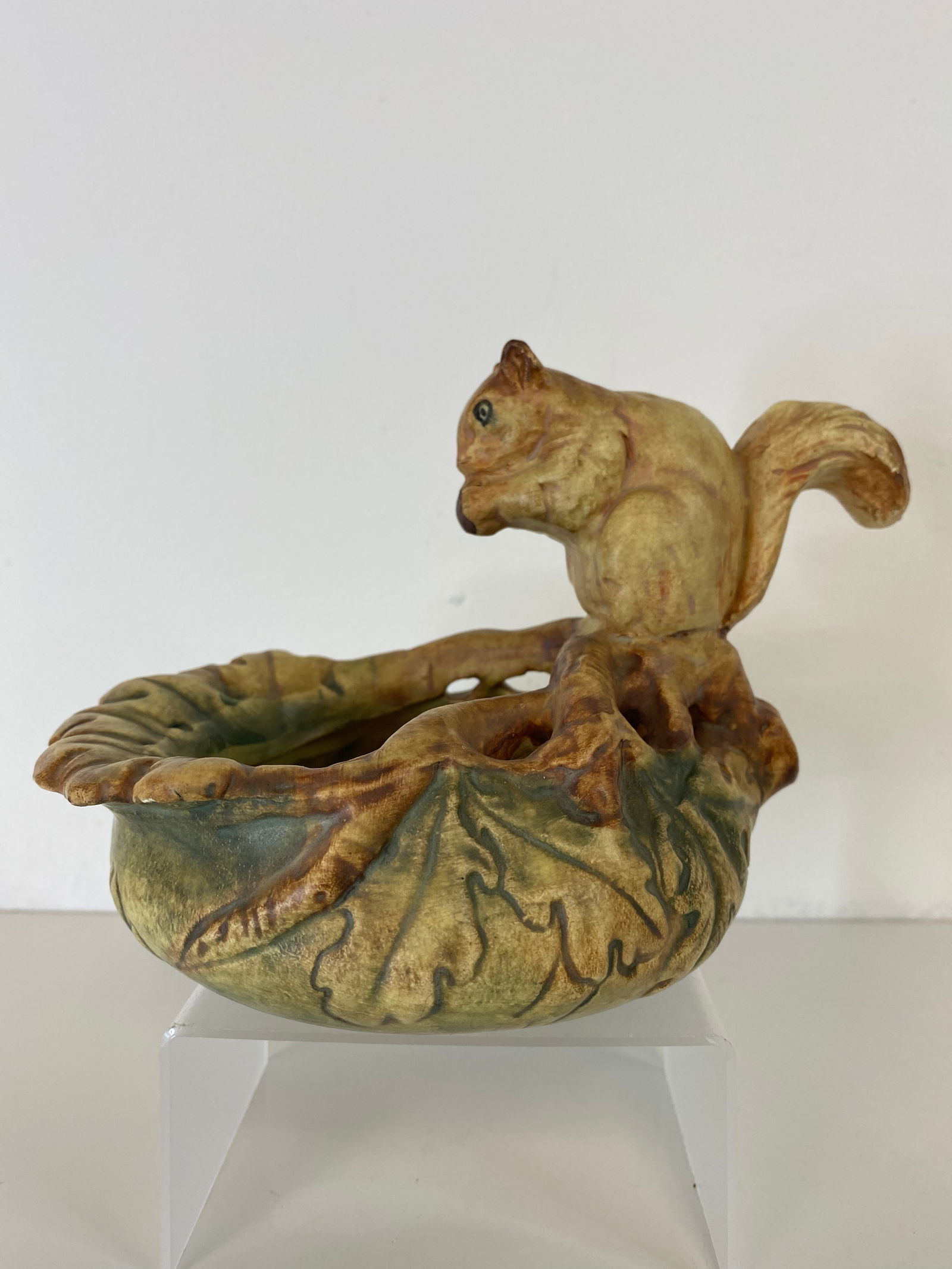 Weller Pottery woodcraft: Squirel having a snack standing 5" tall