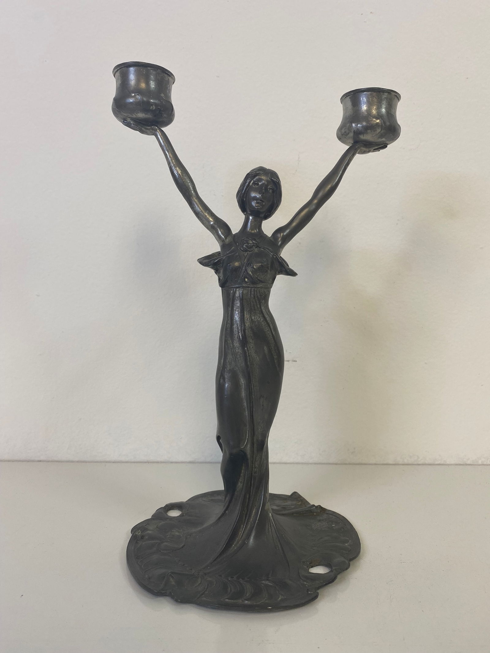 Art Nouveau Candlestick: Lady holding the candle cups made of Pewter and stands9 5/8" tall.
