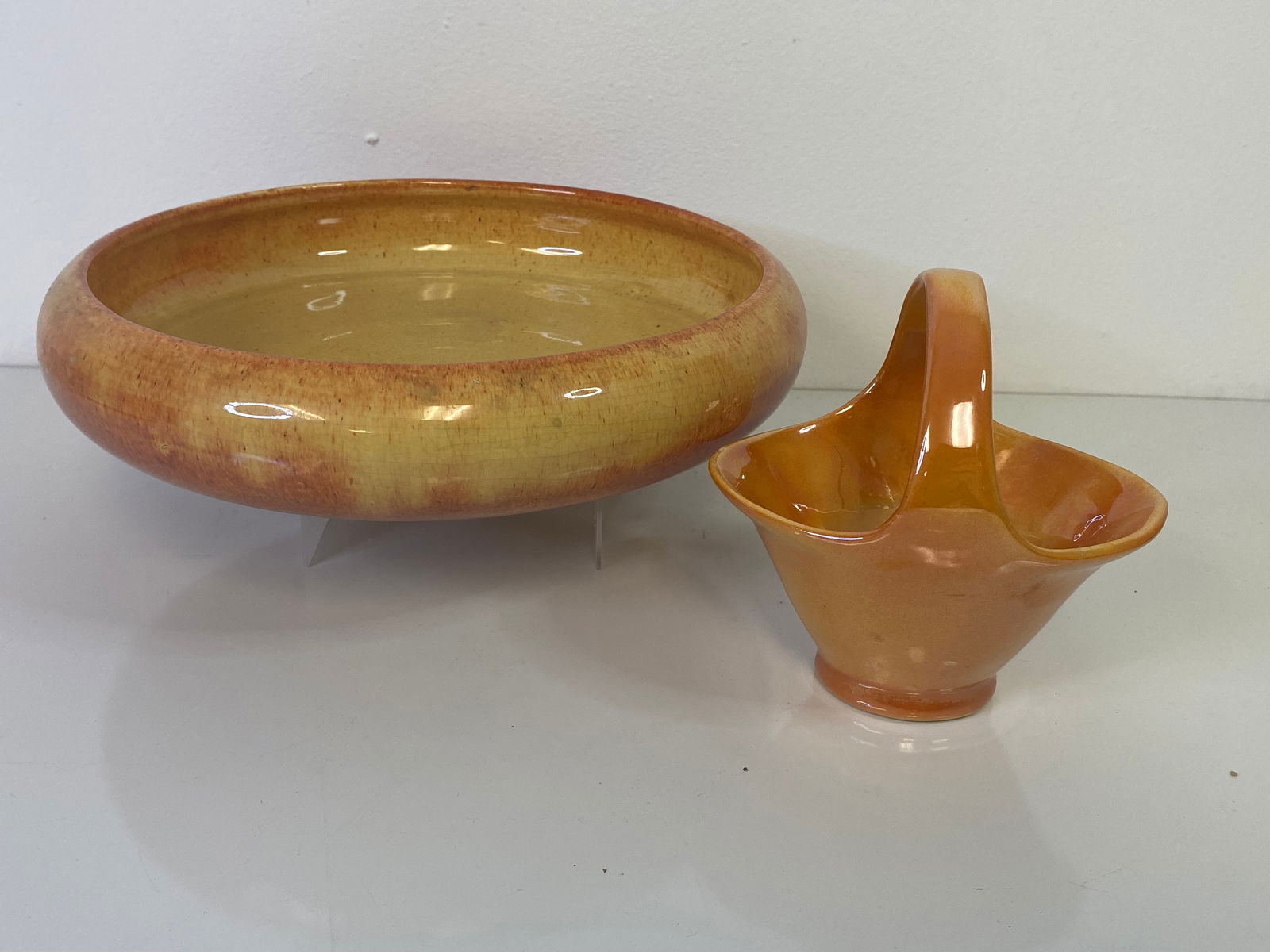 Weller Pottery Muskota: Low bowl that I didn’t think was muskota but the paper label says otherwise along with a basket in a high gloss orange. Bowl measures 10 1/2" wide