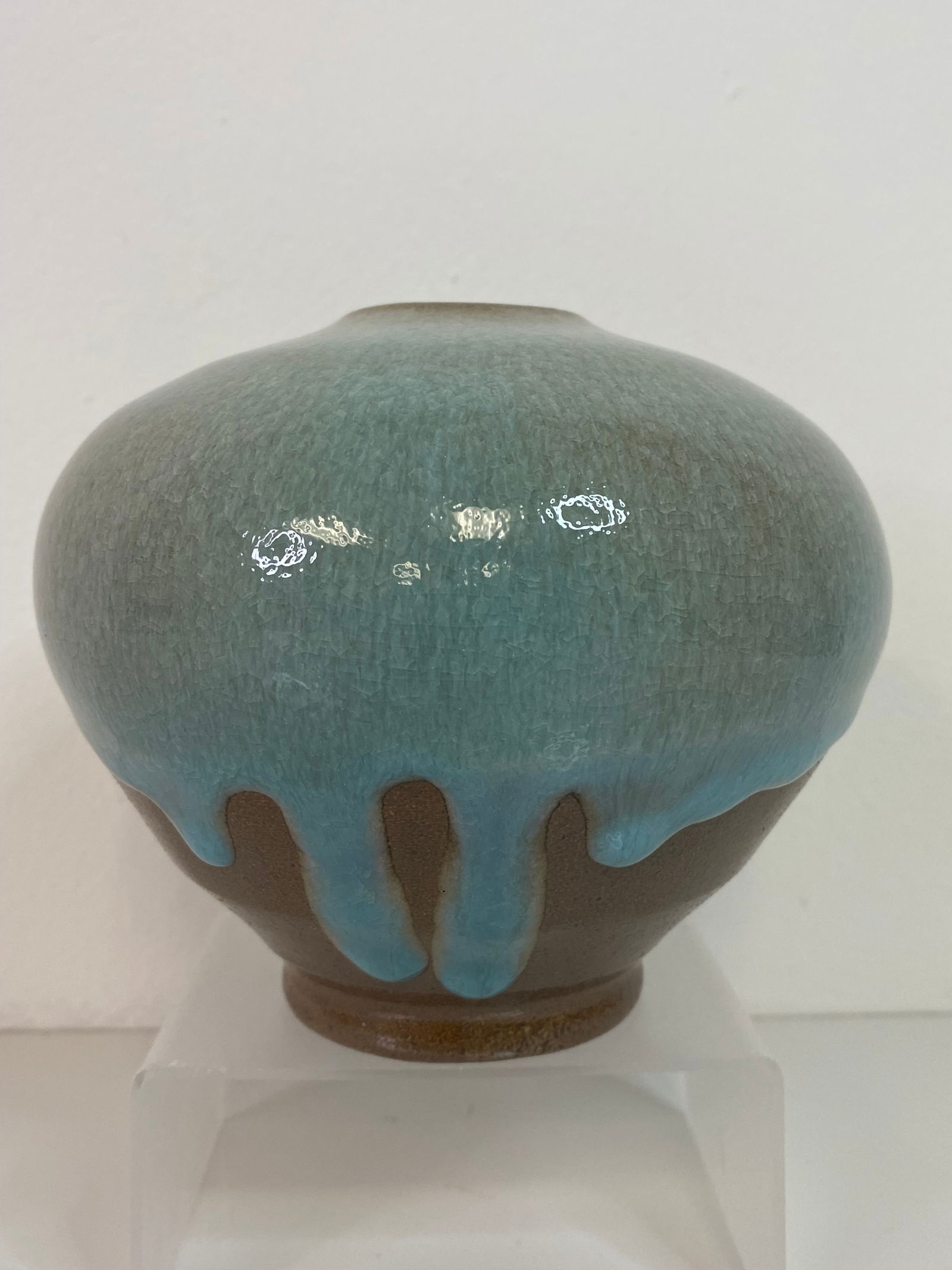 Jugtown Pottery: Good drip glaze with a sweet light blue dripping over the bropown base. Cool pot. 4 3/4" tall