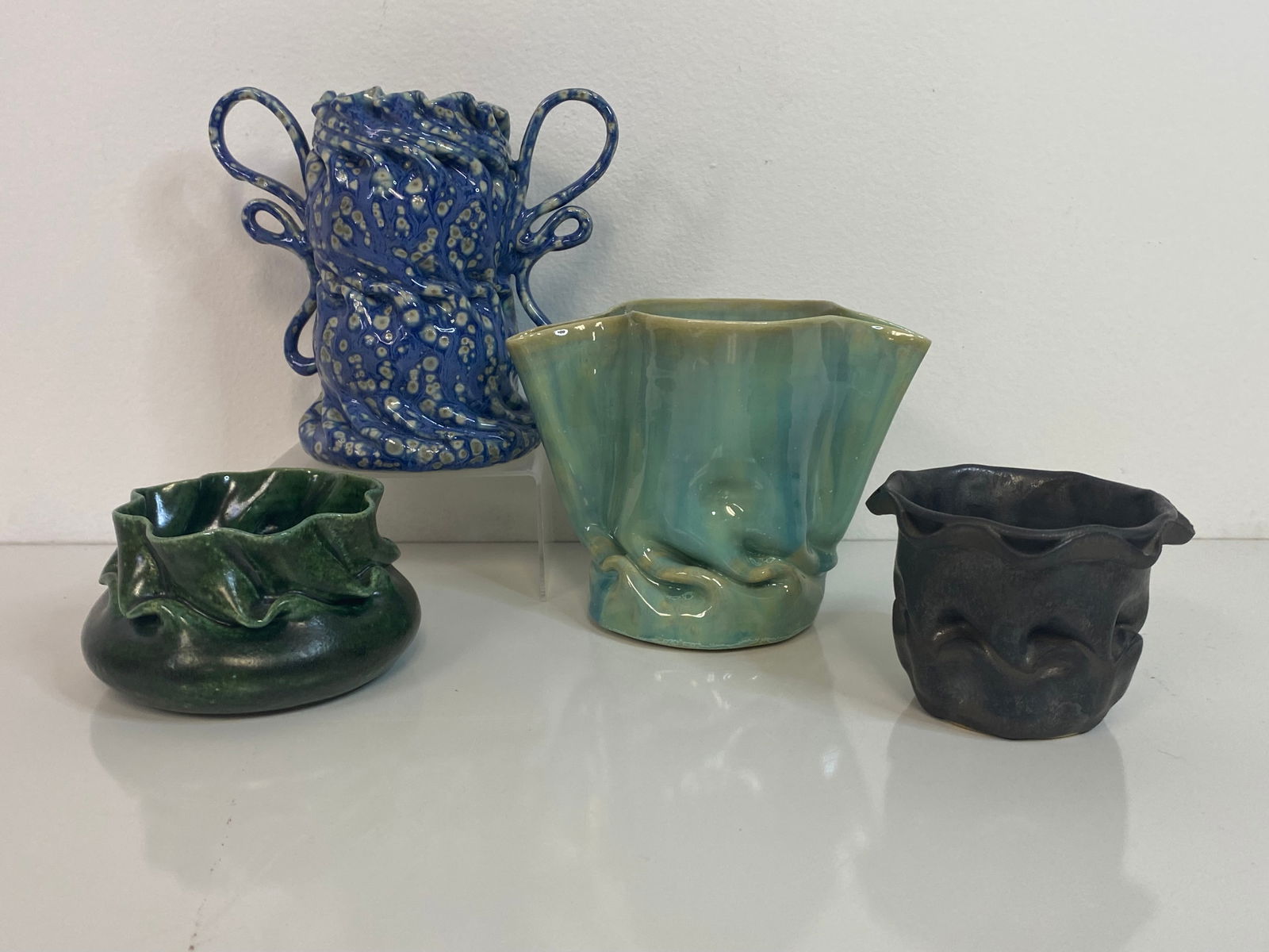 Clark House Pottery group: we have 4 pieces ranging from a double handled tall vase at 5 1/2 tall along with a pinched pitcher is aqua and 2 small bowl in gunmetal and green. Nice collection