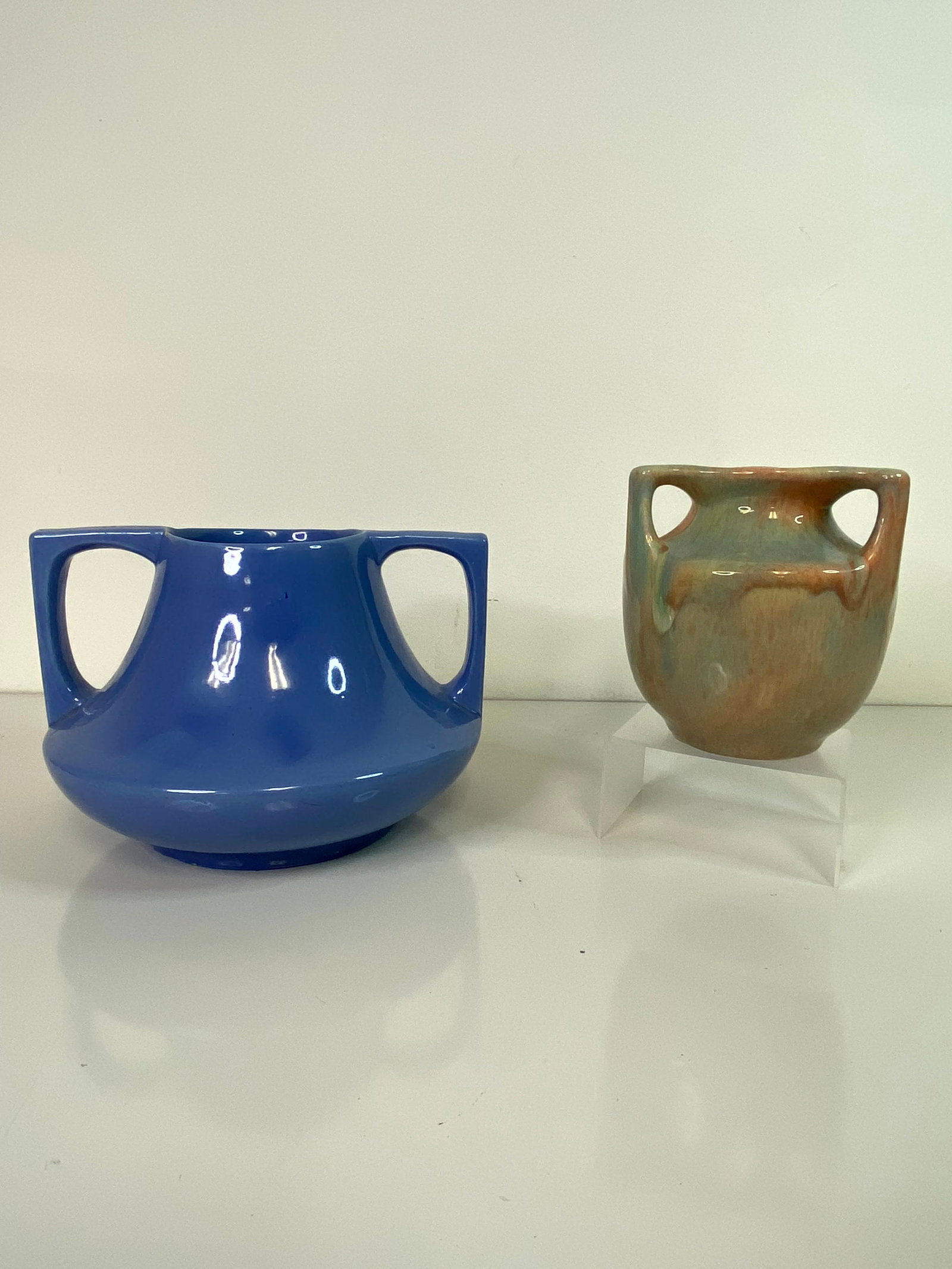 2 Haeger Pottery vases: smaller 3 handle vase at 5" tall with a cool psycodellic glaze and the larger in blue at 8 3/8" wide