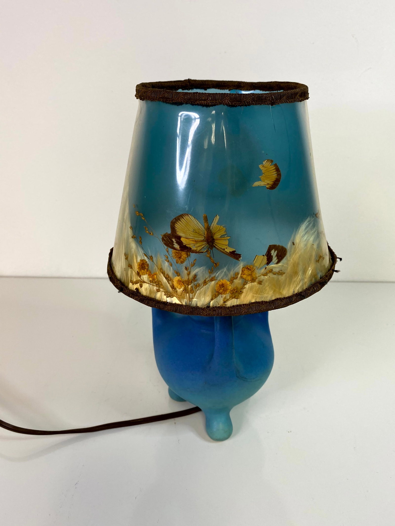 Van Briggle Lamp: 3 footed and 3 handled boudoir lamp standing 5 3/4" tall on the pottery portion. Matching butterfly shade.