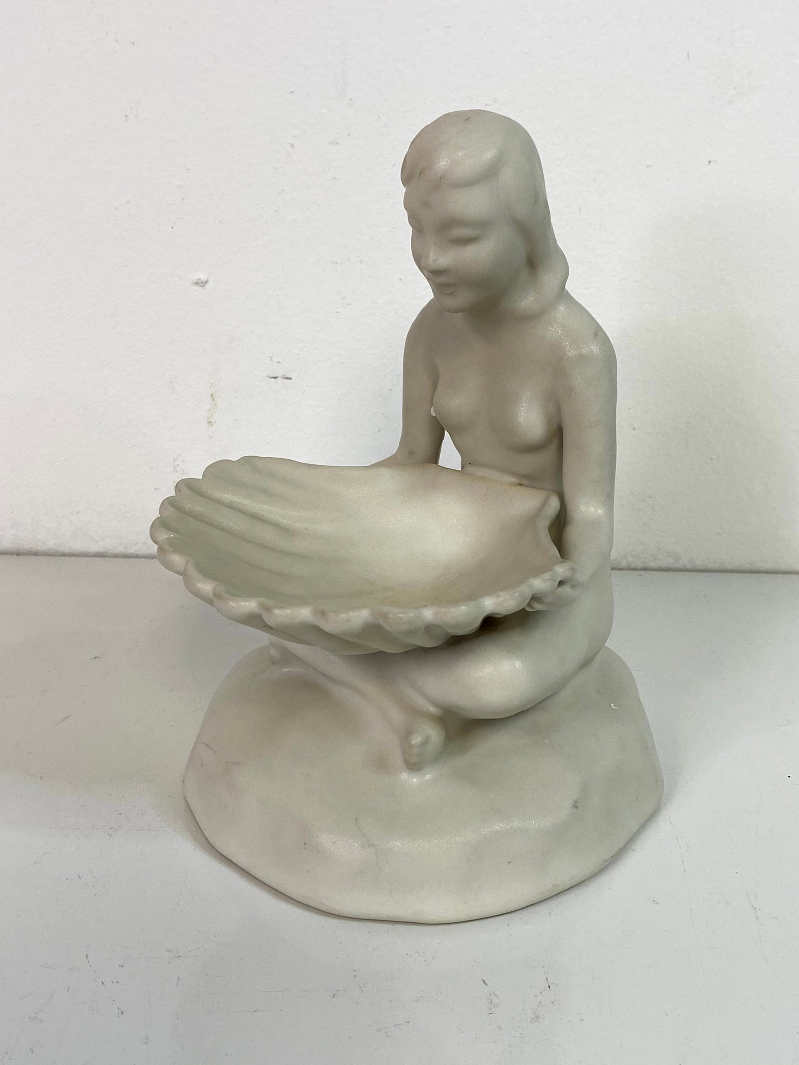 Van Briggle Pottery: Lady holding shell standing about 8"
