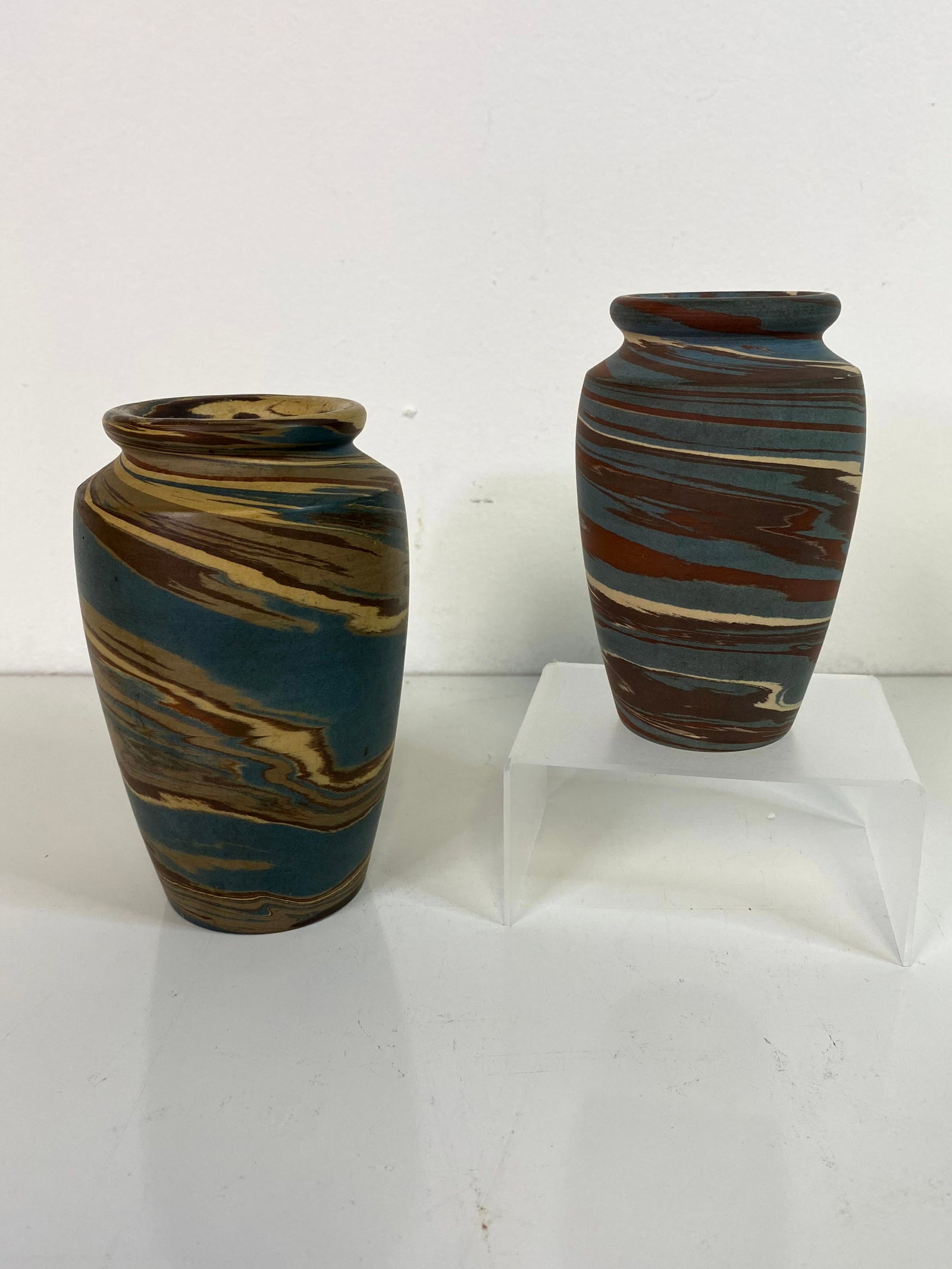 2 Niloak Pottery: taller vase at 5 1/2 with a black stamp next to the stamped signature that I believe says patented something