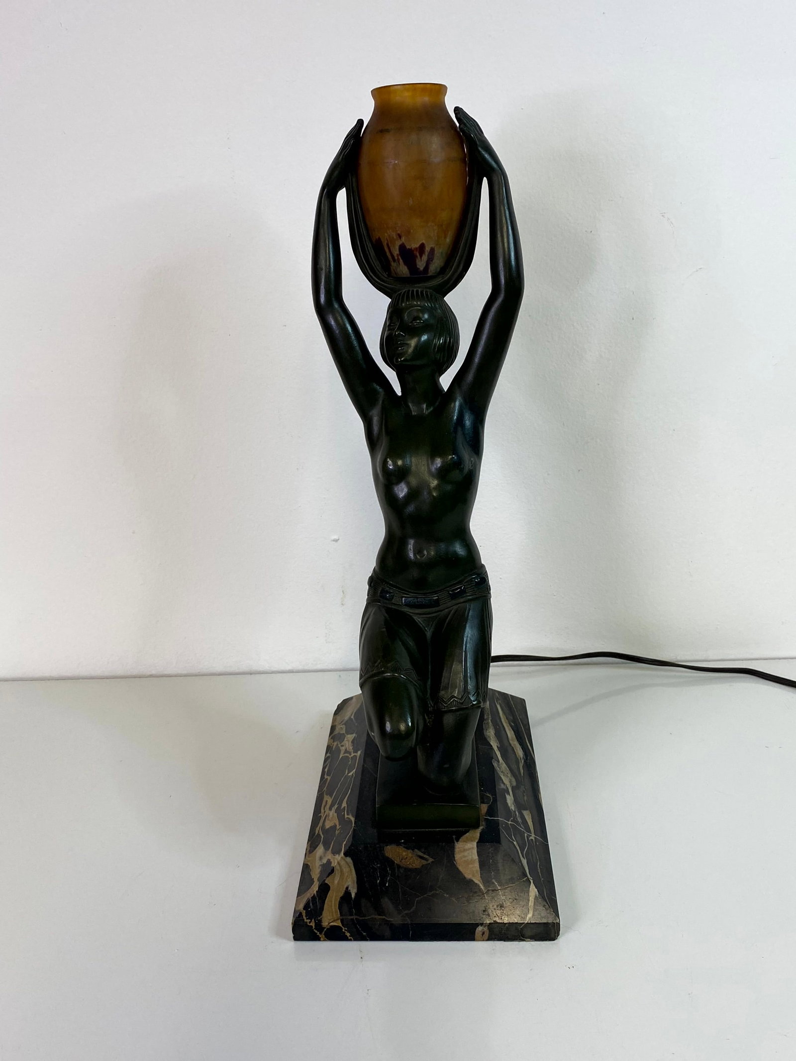 French Art Deco Lamp Fayral: A Fayral Art Deco Lamp 1930's of a nude holding a jar over her head. Signed Fayral and stamped Made in France. 16 1/2" tall