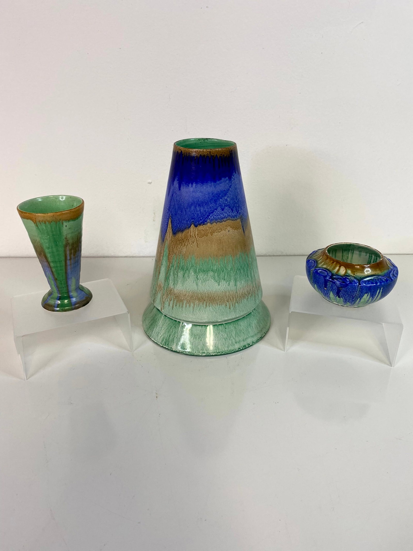 3 Pcs Shelly Pottery England: Very colorful grouping with the largest cone shaped vase at just shy of 8" along with a neat small bowl with decoration at the rim and another cone shape