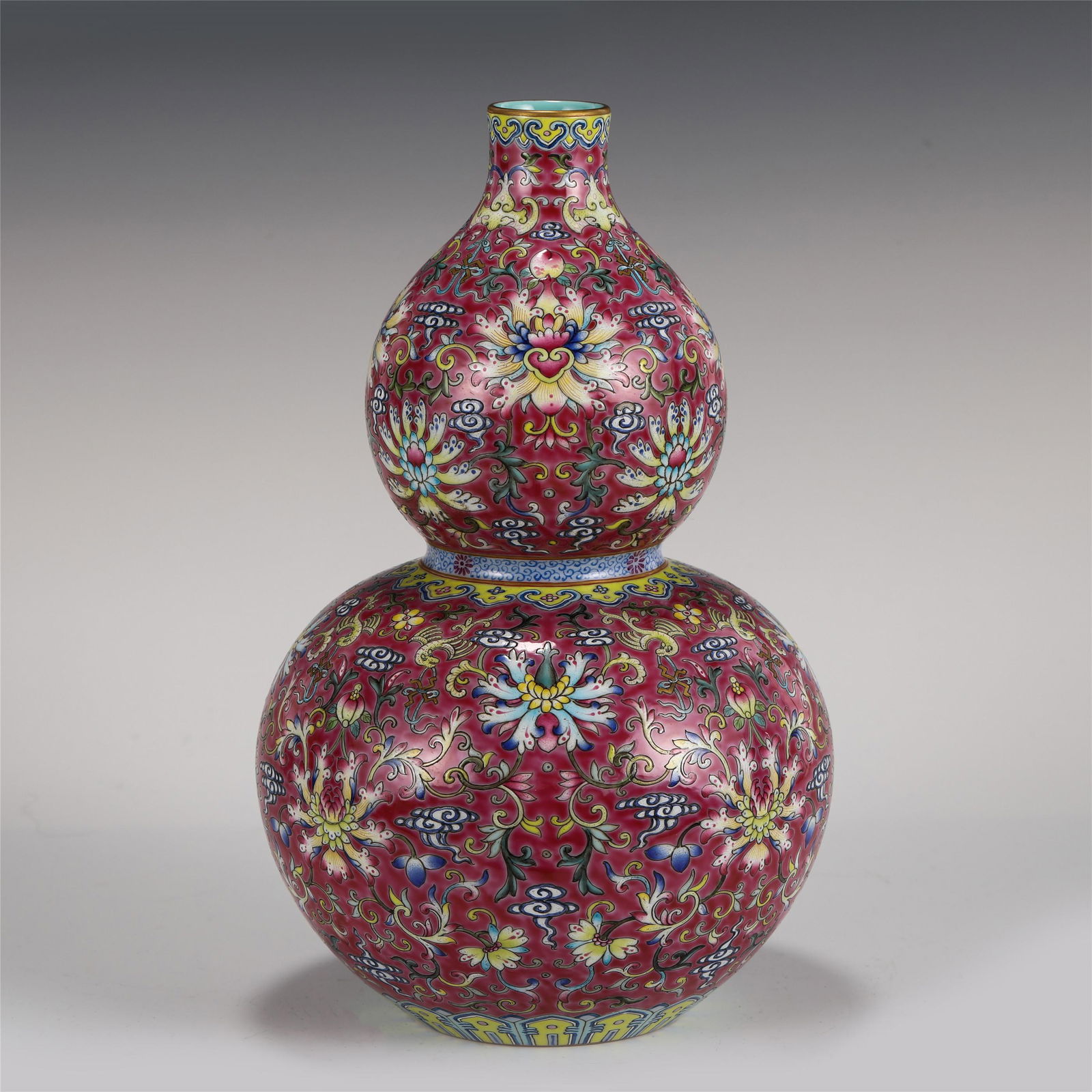 CHINESE FAMILLE ROSE FLOWER PATTERN GOURD BOTTLE: Dimensions: CHINESE FAMILLE ROSE FLOWER PATTERN GOURD BOTTLE 19 cm Diam x 31 cm H A chinese famille rose gourd bottle .Made in The Year of Qianlong Reign Period of The Great Qing Dynasty. The Chinese