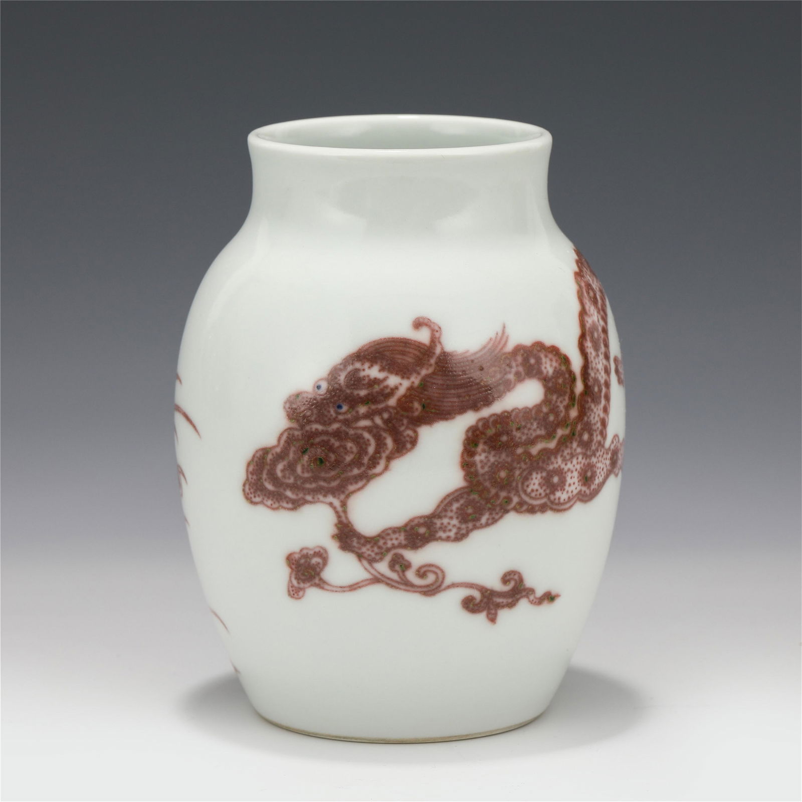 A CHINESE RED UNDER GLAZE PORCELAIN DRAGON PATTERN (1 of 9)