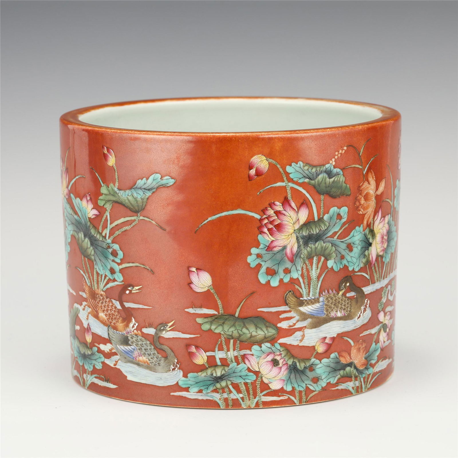 A CHINESE RED GLAZED FLOWER PATTERN PORCELAIN BRUSH POT (1 of 10)