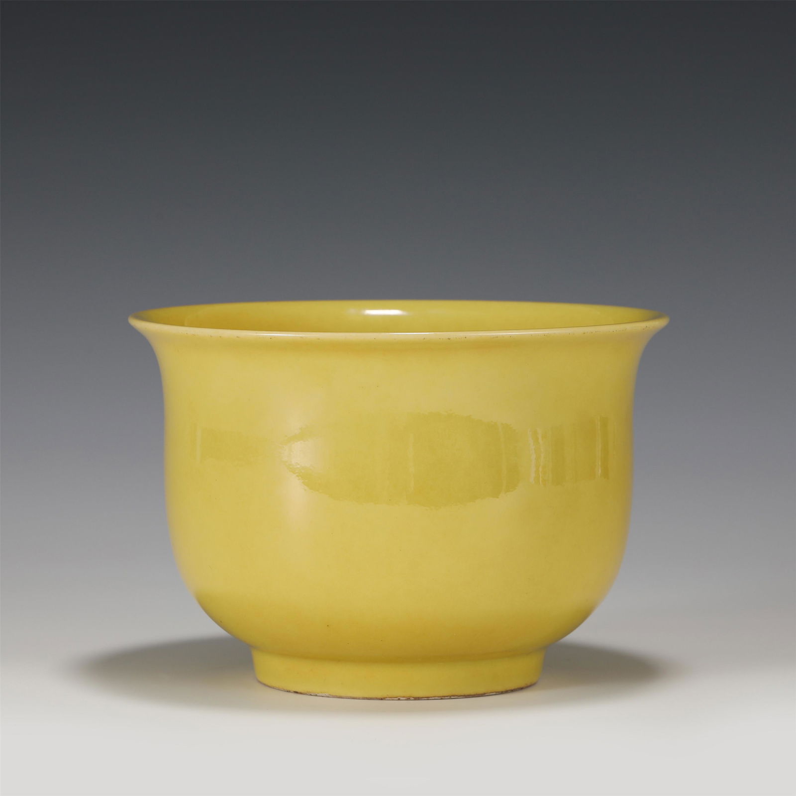 A CHINESE YELLOW GLAZE PORCELAIN BOWL: A CHINESE YELLOW GLAZE PORCELAIN BOWL 16 cm Diam x 10 cm H x Weight 540 gram. The golden bell bowl has a mouth, an arc belly and a circle foot. Yellow glaze shall be applied to the inner and outer wal