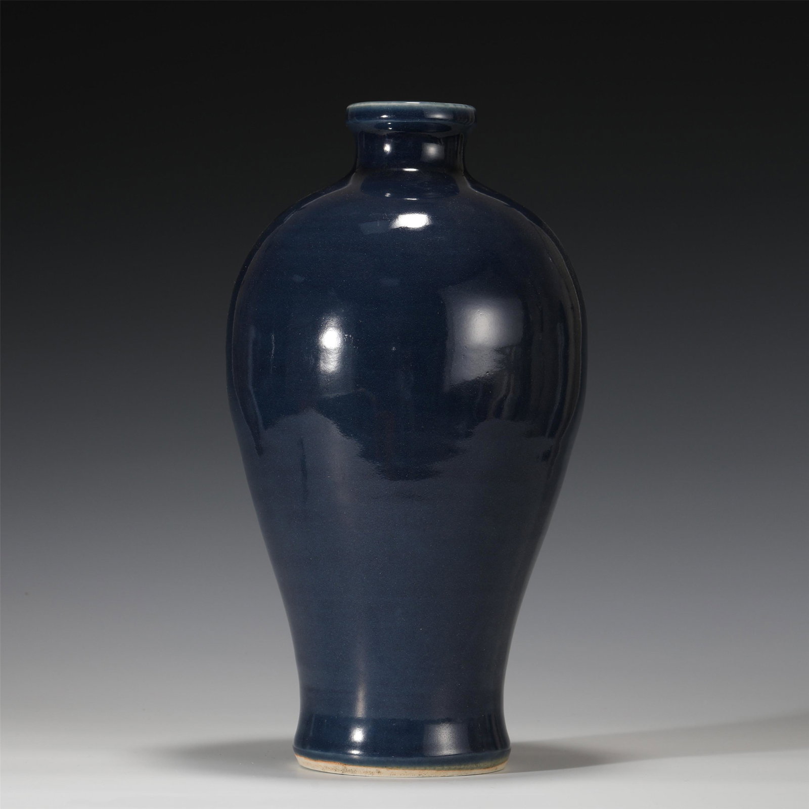A CHINESE BLUE GLAZE PORCELAIN VASE: A CHINESE BLUE GLAZE PORCELAIN VASE 17 cm Diam x 34 cm H x Weight 2290 gram. The bottle is applied with Ji blue glaze as a whole. The glaze is thick and fat, with bright color, Ying run, quiet and ele