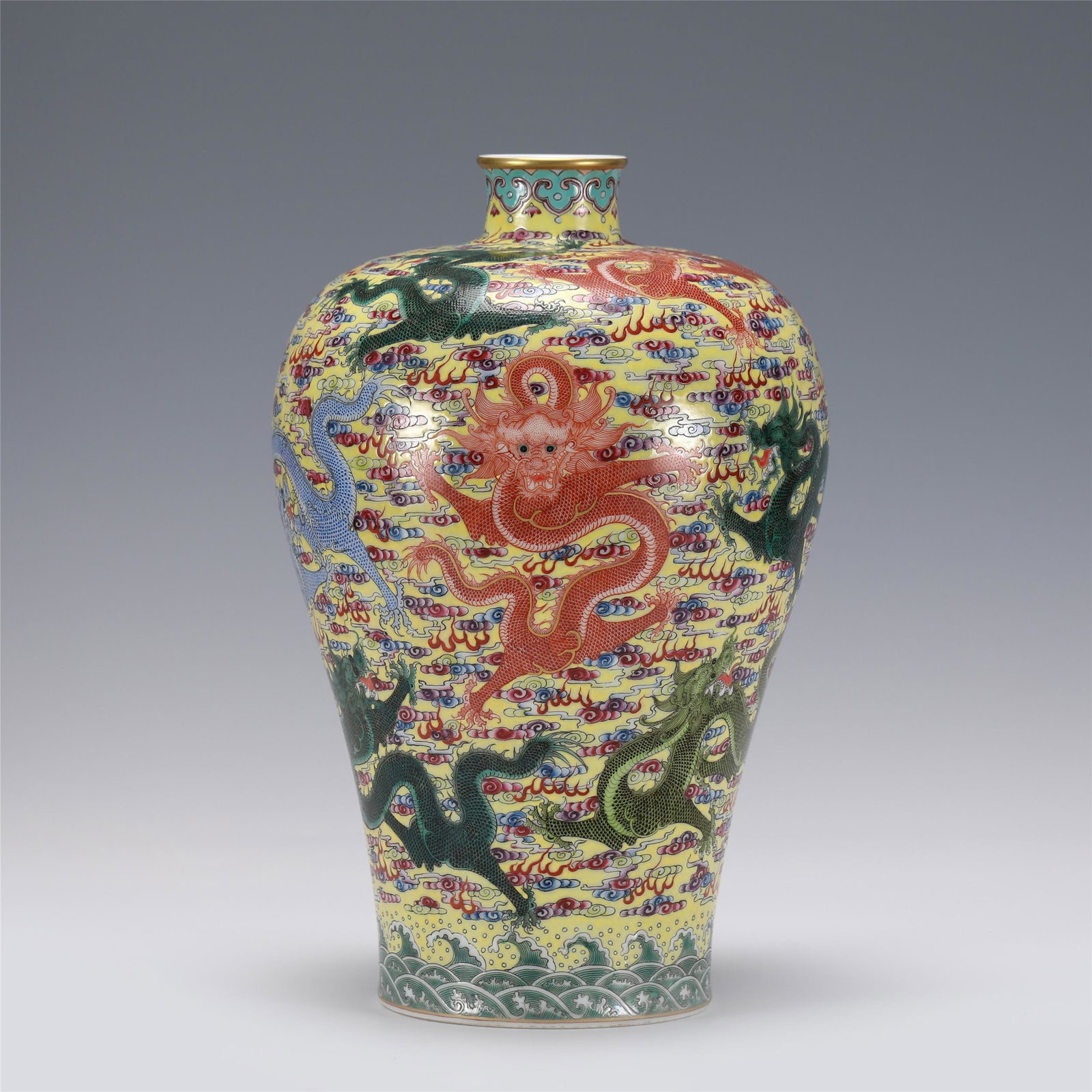 A CHINESE FAMILLE ROSE DRAGON PATTERN PORCELAIN: A CHINESE FAMILLE ROSE DRAGON PATTERN PORCELAIN VASE,YONGZHENG 24 cm Diam x 37 cm H Rising from a slightly splayed foot to a high-shoulder body blow a short, waisted neck, painted leaping dragon amids