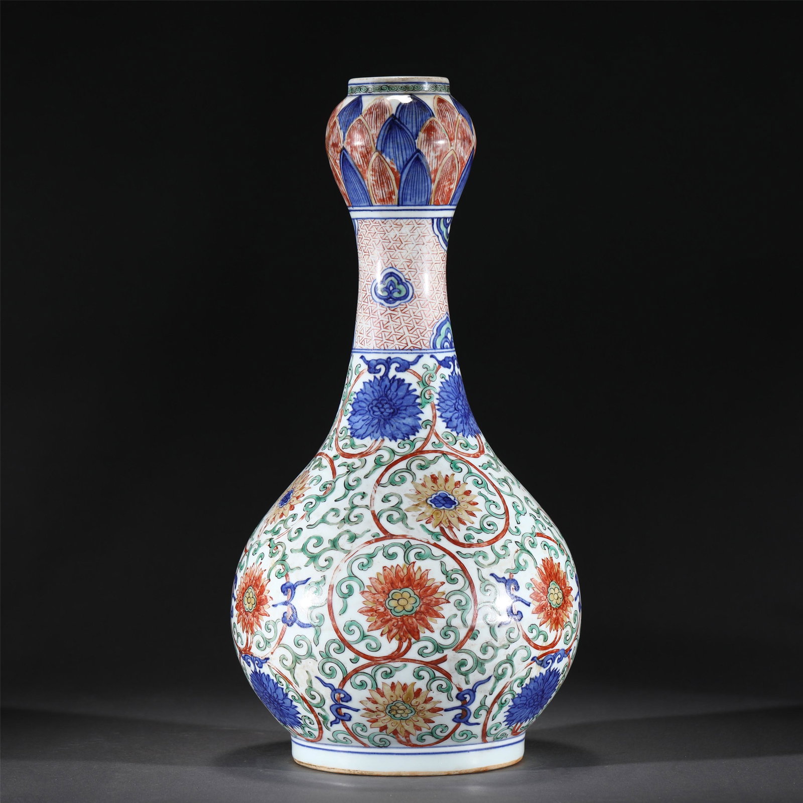 A WUCAI GLAZE PORCELAIN VASE,WANLI: A WUCAI GLAZE PORCELAIN VASE,WANLI 22.5 cm Diam x 43 cm H x Weight 3060 gram. Well potted with a pear-shaped body and painted with floral scrolls in famille verte glaze, all raised on a short foot.