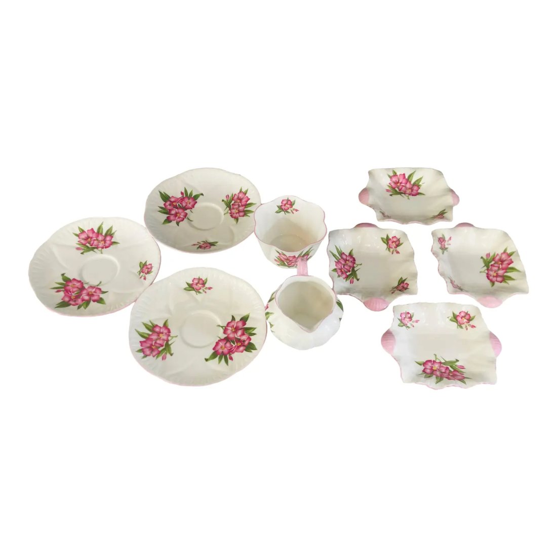 Shelley Porcelain Art Deco Serving Set - 8 Pieces: An Art Deco Shelley serving tea time set with 8 pieces in good condition. The porcelain pieces features beautiful flowers designs. Biggest plate 6 in diameter.