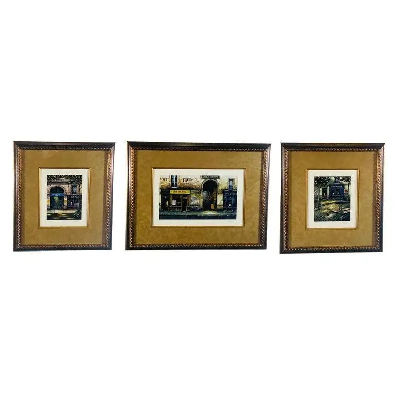 Vintage Print of Parisian Street Scenes, Signed and Numbered, a Set of Three: A set of three beautiful framed and matted prints depicting scenes of the street of Paris. Full of life and creativity, the streets of the city of lights seduce us with its artisan shops and colorful