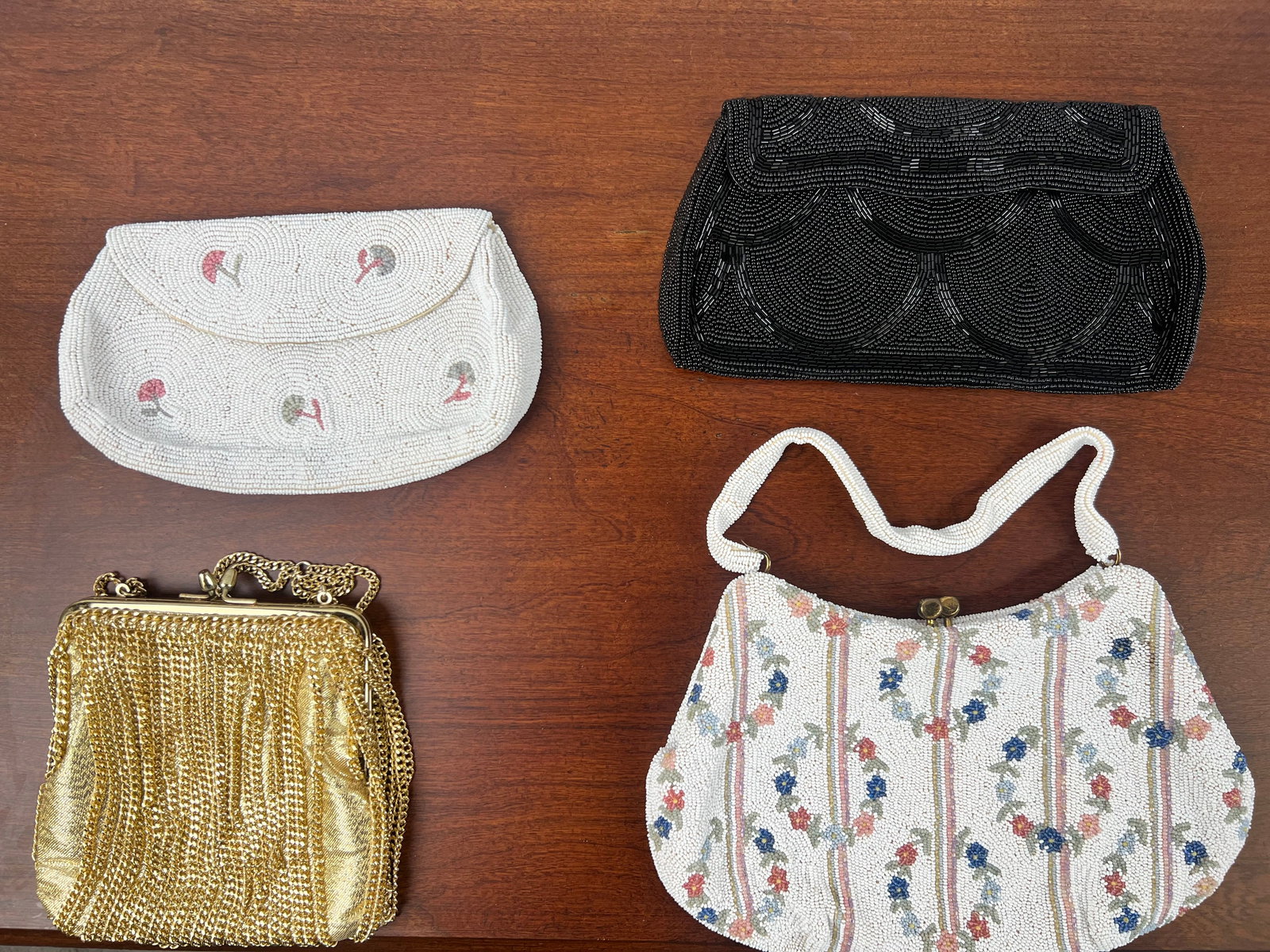 lady night evening clutches or bags set of 4: A charming collection of vintage clutch bags featuring elegant beadwork and classic evening styles.