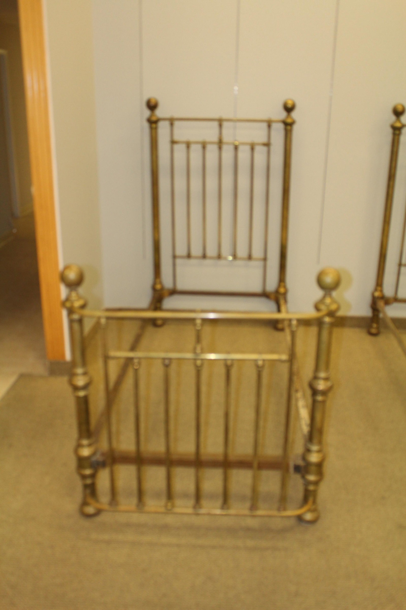 Pair American Twin Brass beds: CONDITION NOTES: overall good condition. Some minor dents and a few missing small ball finial rod caps MEASUREMENTS: 61 1/2 " x 37" x 85 3/4"