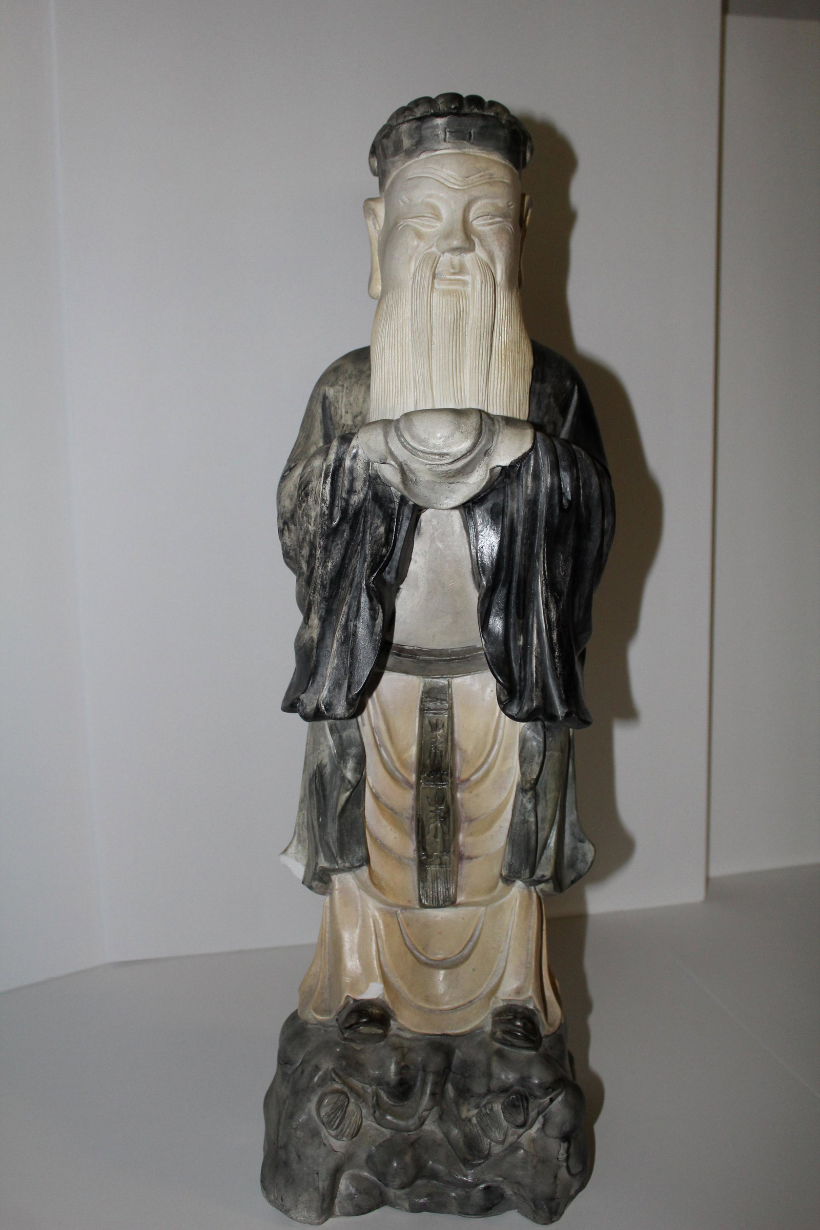 Chinese Plaster Figure of a Scholar: CONDITION NOTES: There are some plaster chips in pictures MEASUREMENTS: 24 1/2"x 7 1/2" x 5 1/2"