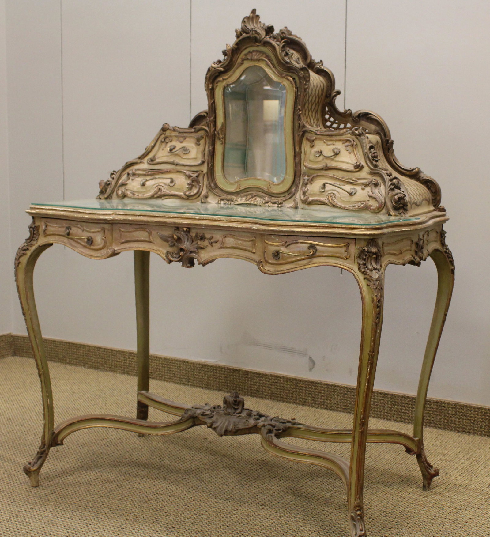 Venetian Rococco Carved Parcel-gilt Dressing Table: 19th C, heavily carved 5 drawers and a center display cabinet
