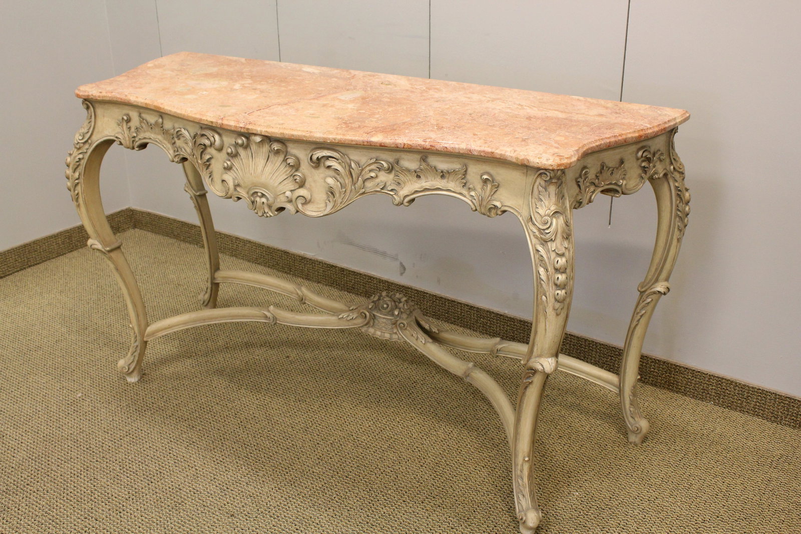 Louis XV Style Silver Gilt Marble Top Console Table: Serpentine form with conforming stretcher; finely carved