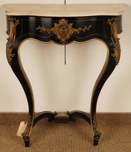 French Louis Phillippe Marble Top Console table: Serpentine form with brass inlay and gilt bronze mounts