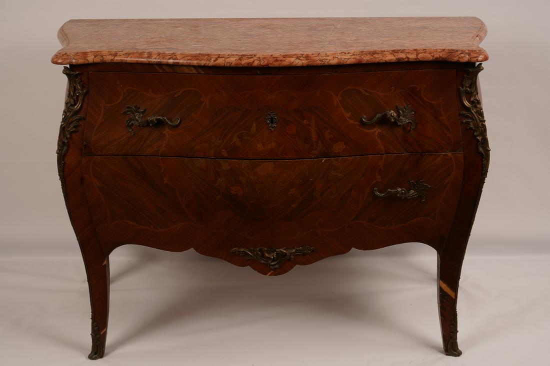 Louis XV Style Two Drawer Marble Top Commode: Serpentine rouged marble top over two drawers; fitted with bronze mounts. Overall floral marquetry inlay.
