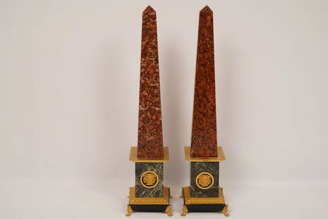 Pair French Empire Marble Gilt Bronze Obelisks: Rouge and green marble separated by bands of gilt bronze centering a bronze mask raised on paw feet; Property of Ambassador Stuart Bernstein