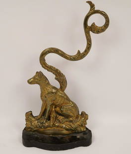 Georgian Brass and Cast Iron Door Stop: Depicting a seated dog in a foliate landscape. Property of Ambassador Stuart Bernstein.