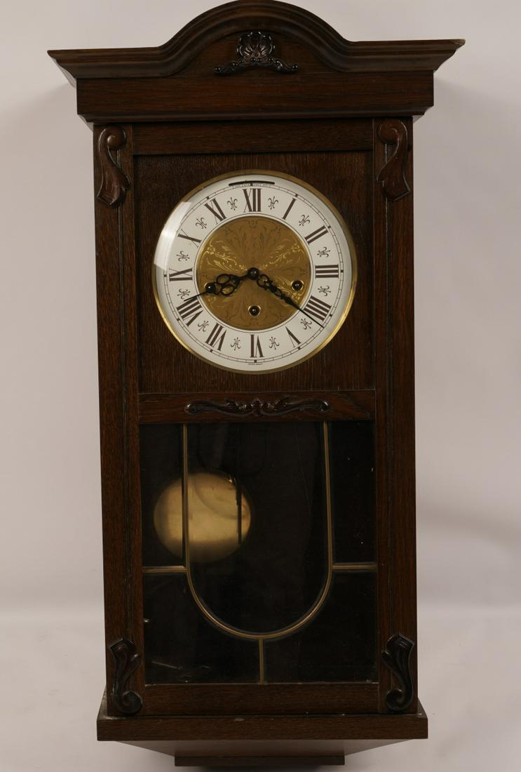 German Oak Wall Clock: 20thC made in West Germany, working condition with key