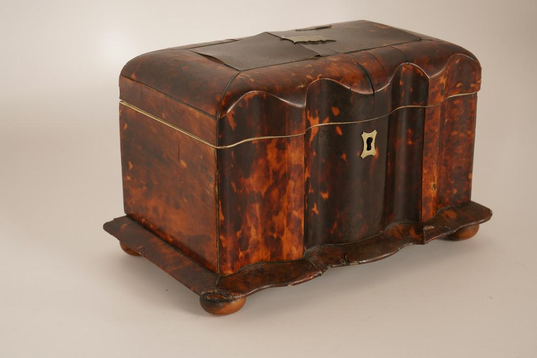 English Regency Tortoiseshell Double Compartment: 19th Century, with fluted shaped front, sterling silver escutcheon and shaped blank name plaque on lid, on bun feet