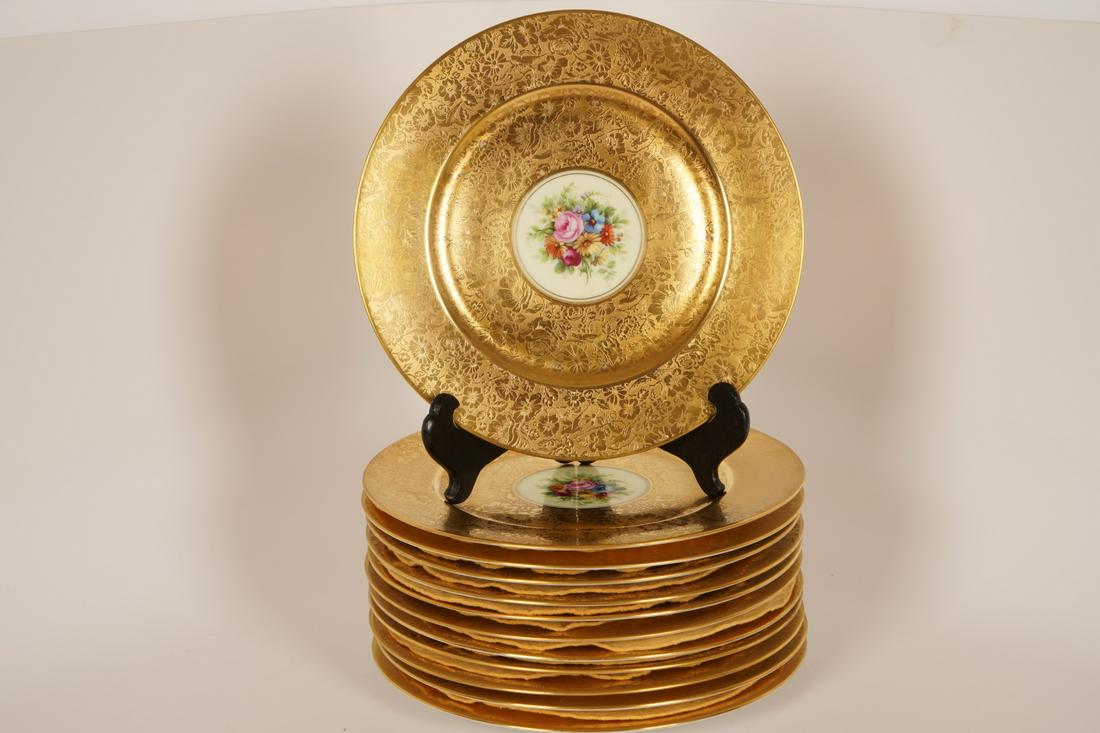 12 Heinrich Selb Bavaria Porcelain Dinner Plates: Gilt surface with floral decoration and birds; centers are hand painted with floral sprays