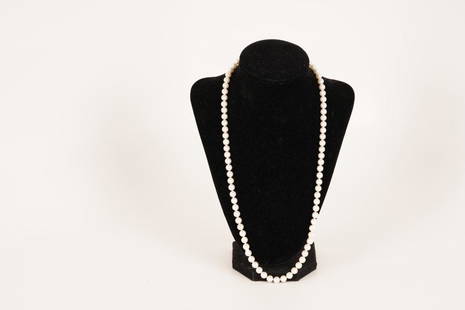 Mikimoto Pearl Necklace: 14K clasp; 24" strand with 6.5mm to 7mm pearls